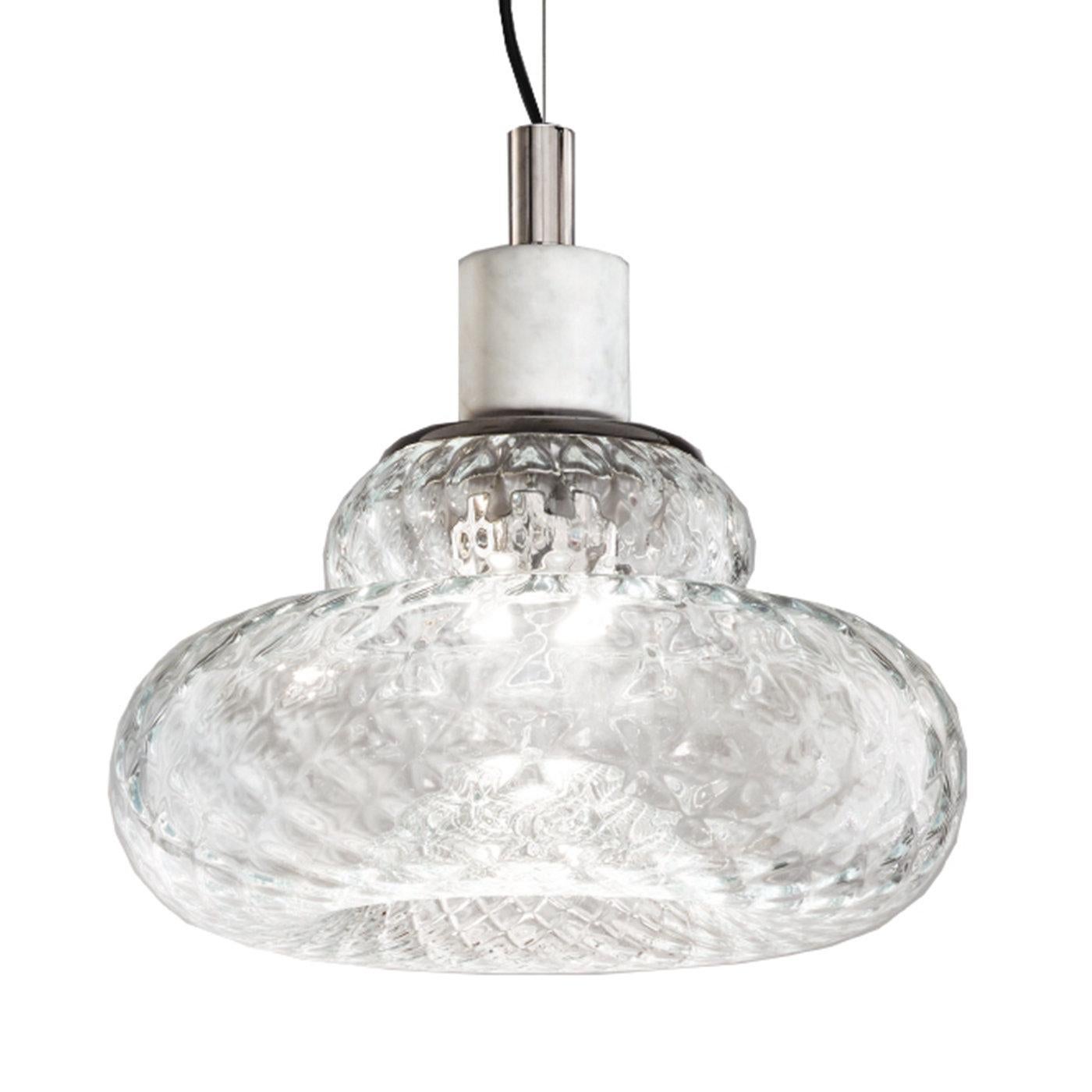 The pureness of Carrara marble and crystal Murano glass merge in this stunning pendant lamp whose shade celebrates the fluidity of convex and concave lines. The glass diffuser's design is embellished with the 