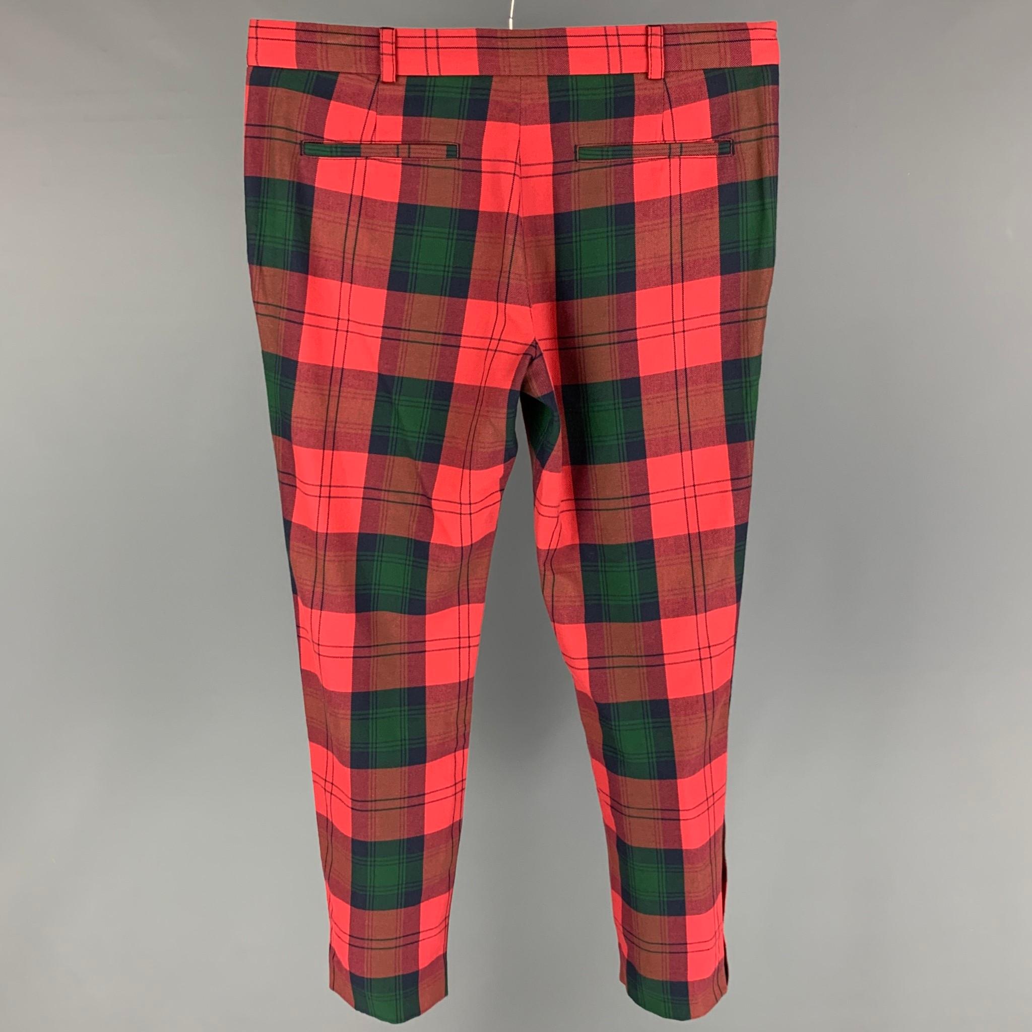 VERSUS by GIANNI VERSACE dress pants comes in a red & green plaid cotton featuring a flat front, silver tone hardware, and a zip fly closure. 

Excellent Pre-Owned Condition.
Marked: 50

Measurements:

Waist: 36 in.
Rise: 11 in.
Inseam: 28 in. 