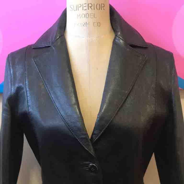 This vintage Versus by Versace black leather jacket w/ buckles at the waist is a great find! Perfect 4 Fall dressing! Pair w/ black skinny pants & boots and crisp white shirt underneath. Fitted style shows off your curves. Signs of age and use in