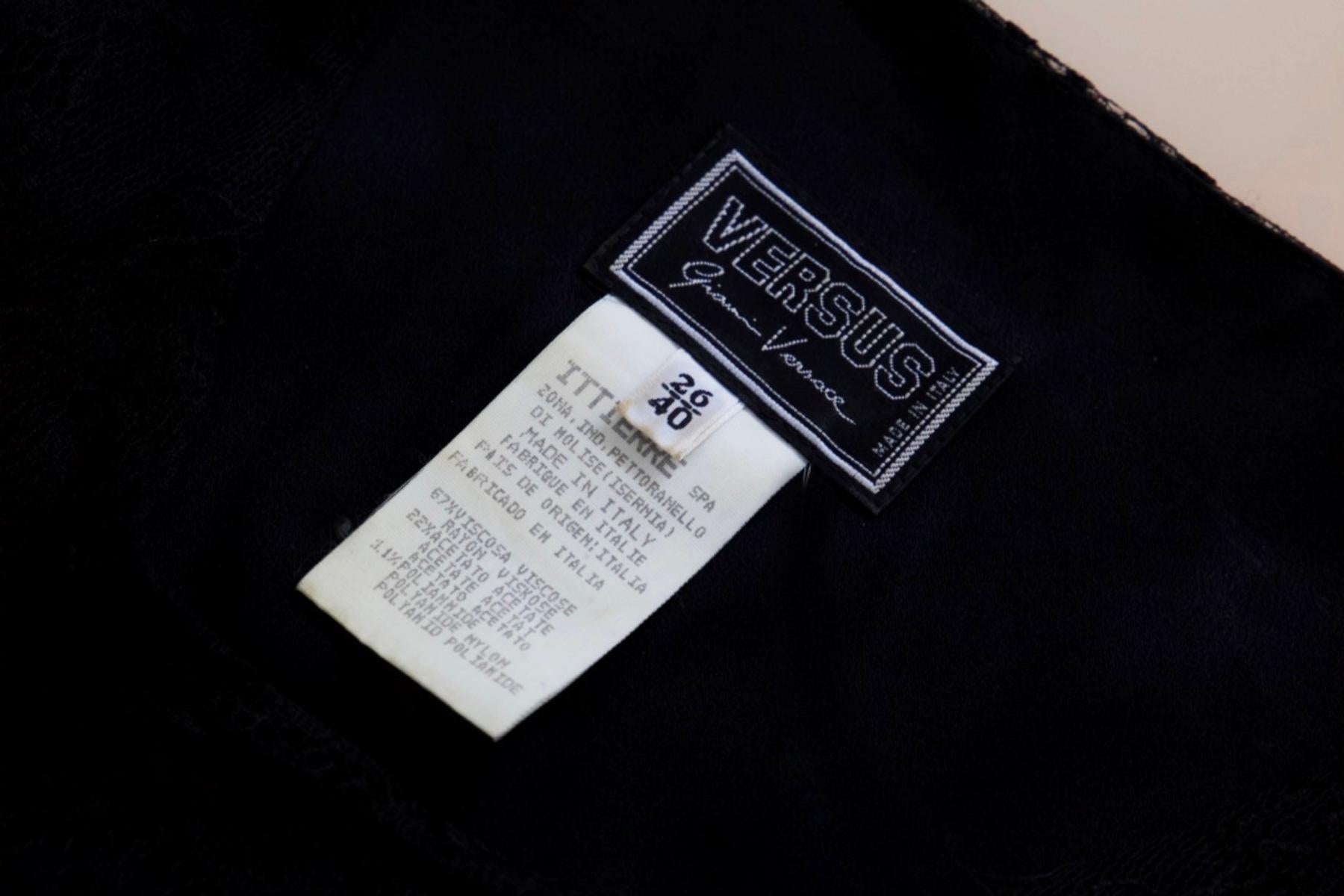 Very simple dress designed by versus Versace in the 1990s, made in Italy. ORIGINAL LABEL.
The dress is made entirely of black lace, with wide straps and sleeveless, it falls super soft to the knees.
There is a zipper on the back of the dress that