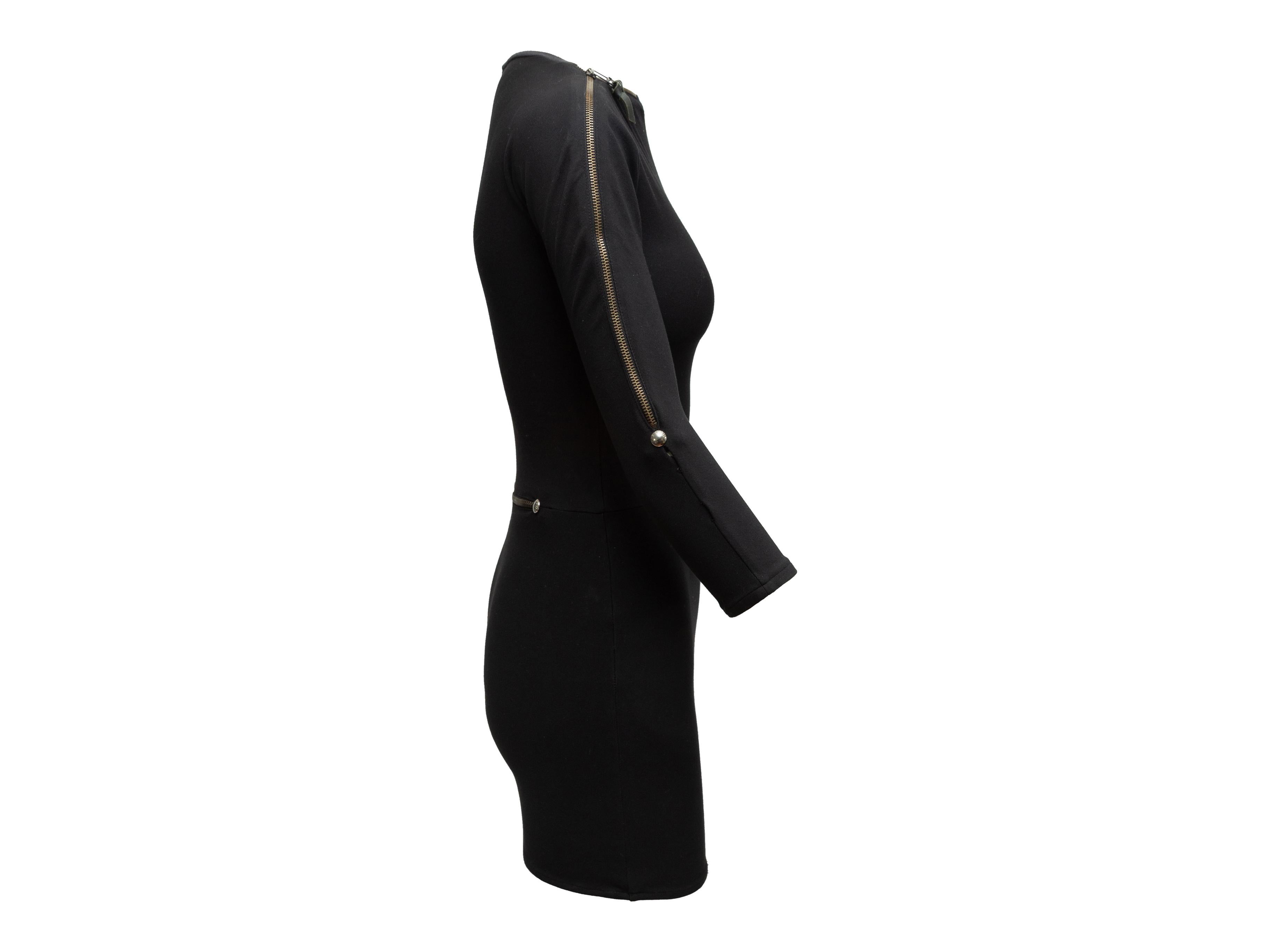 Product details: Black fitted mini dress by Versus Versace. Crew neck featuring zip accent. Long sleeves. Zip accent at waist. Designer size 38. 24