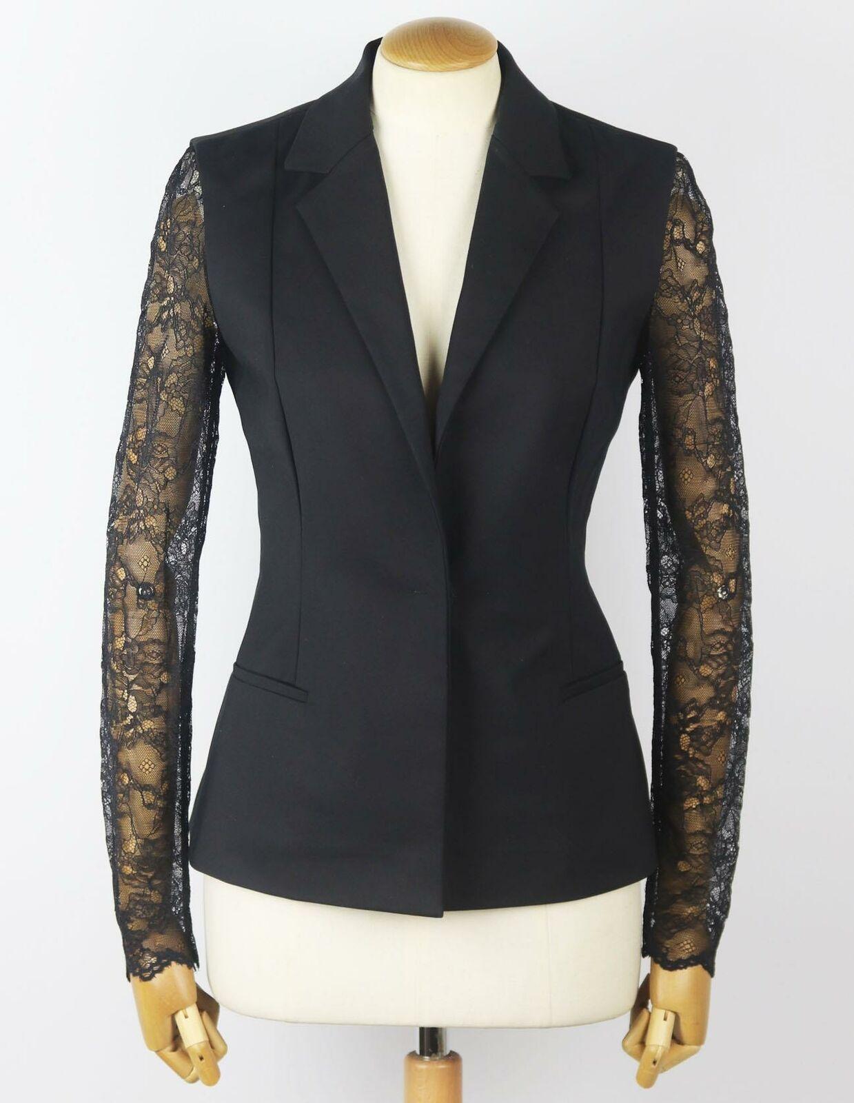 Demonstrating just how glamorous tailoring can be, Versus Versace's blazer is paneled with delicate lace down the sleeves, it has been cut for a close fit in Italy from mid-weight cotton-blend and padded shoulders for structure.
Black cotton-blend,