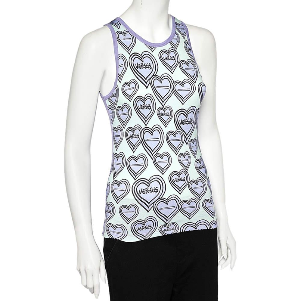 This tank top from Versus Versace exhibits mastery in crafting classic silhouettes and lending a free-flowing look. It is tailored using purple and green Heart printed knit fabric. Wear this top with a pair of jeans and sport a comfortable and chic