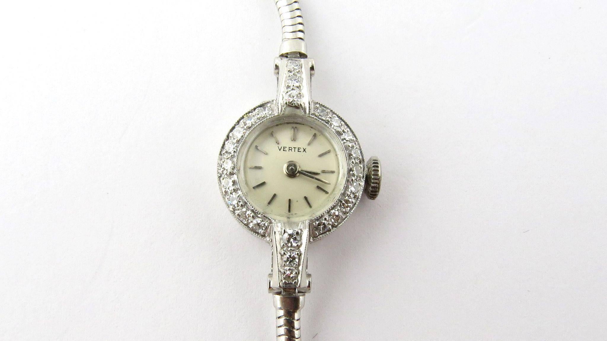 Vintage Vertex Classic Platinum White Gold Diamond Cocktail Watch 

This classic ladies watch is dainty and elegant. 

The platinum case is set with a diamond bezel of 18 single cut diamonds. 

The case to band contains 6 single cut diamonds in