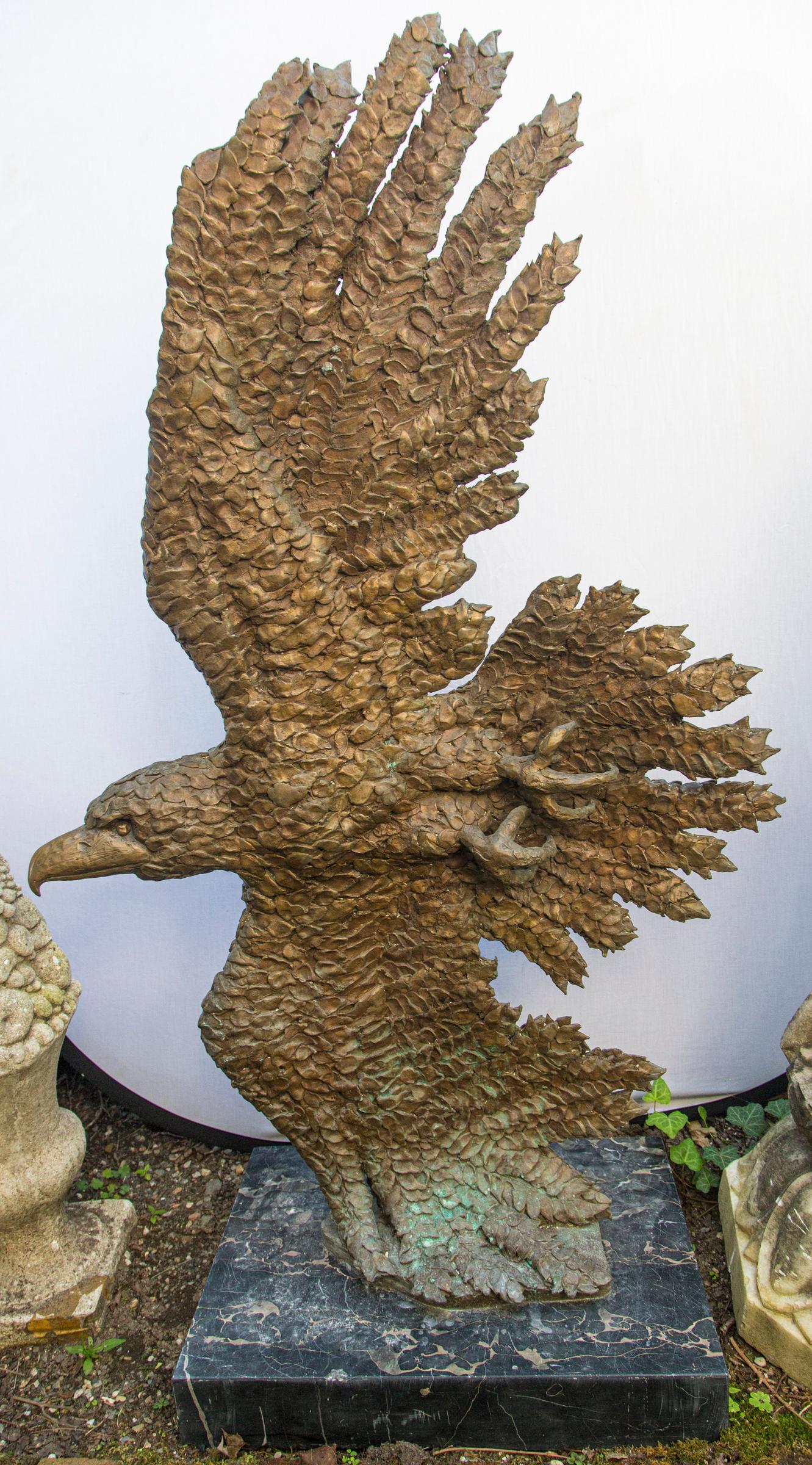 Mounted on a black and beige veined marble base, measuring 24 inches wide, 16 inches deep and 4 inches tall. The overall height is therefore 57 inches.
Golden color with some vertigris appearing, as shown. Each bronze feather separately placed by