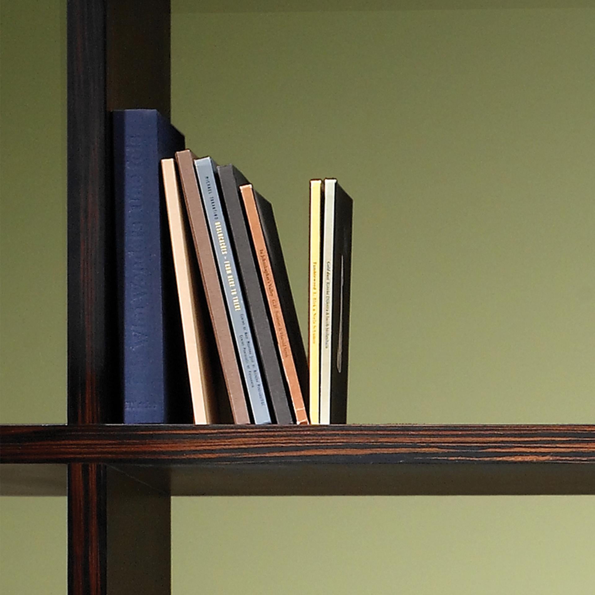 Vertical bookcase in ebony.

Bespoke / Customizable
Identical shapes with different sizes and finishings.
All RAL colors available. (Mate / Half Gloss / Gloss)