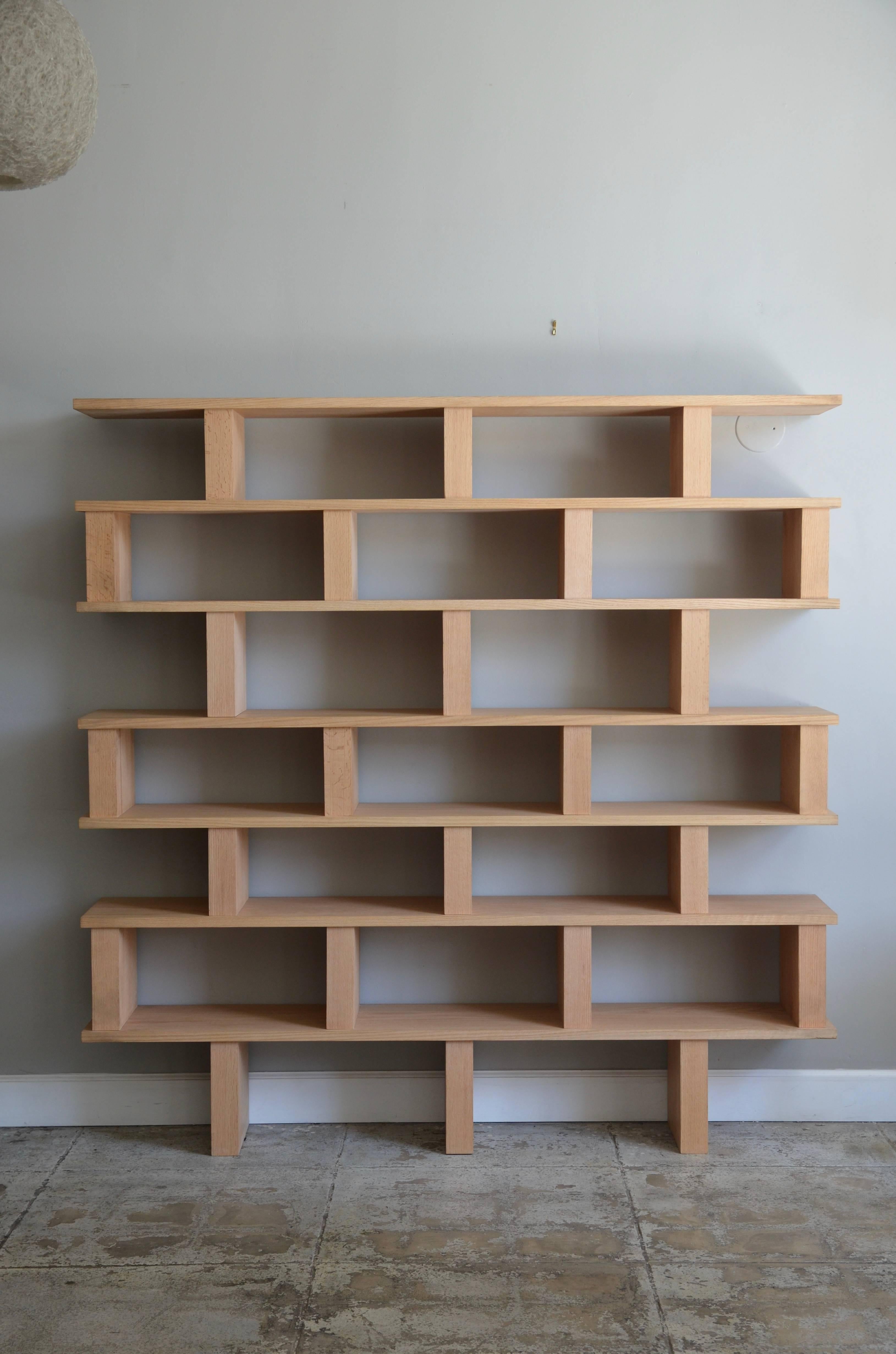Chic 'Verticale' polished oak shelving unit by Design Frères.

Handmade in solid oak, polished and with a clear matte finish in our Los Angeles atelier.

Assembles in two parts for easy shipping and moving.

This shelving unit by Design Frères