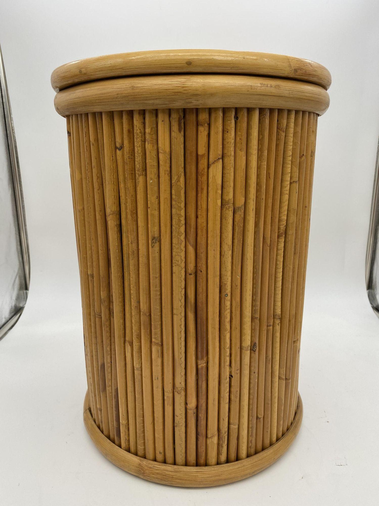 Mid-century era vertically stacked rattan pedestal side table with wood top and rattan border. Measure: 18