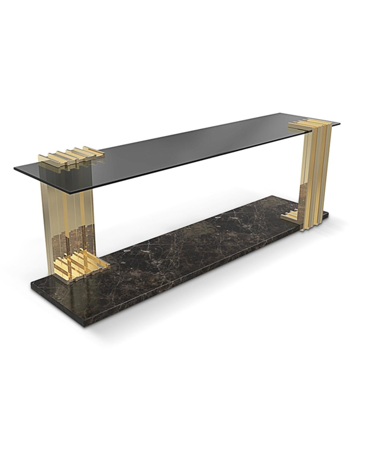 With a bold yet sophisticated design and the finest materials, Vertigo long side table upholds the sleek, sublime appeal of the Vertigo family. Its unique shape and brass, smoked glass, and Nero Marquina marble body draw attention and become the