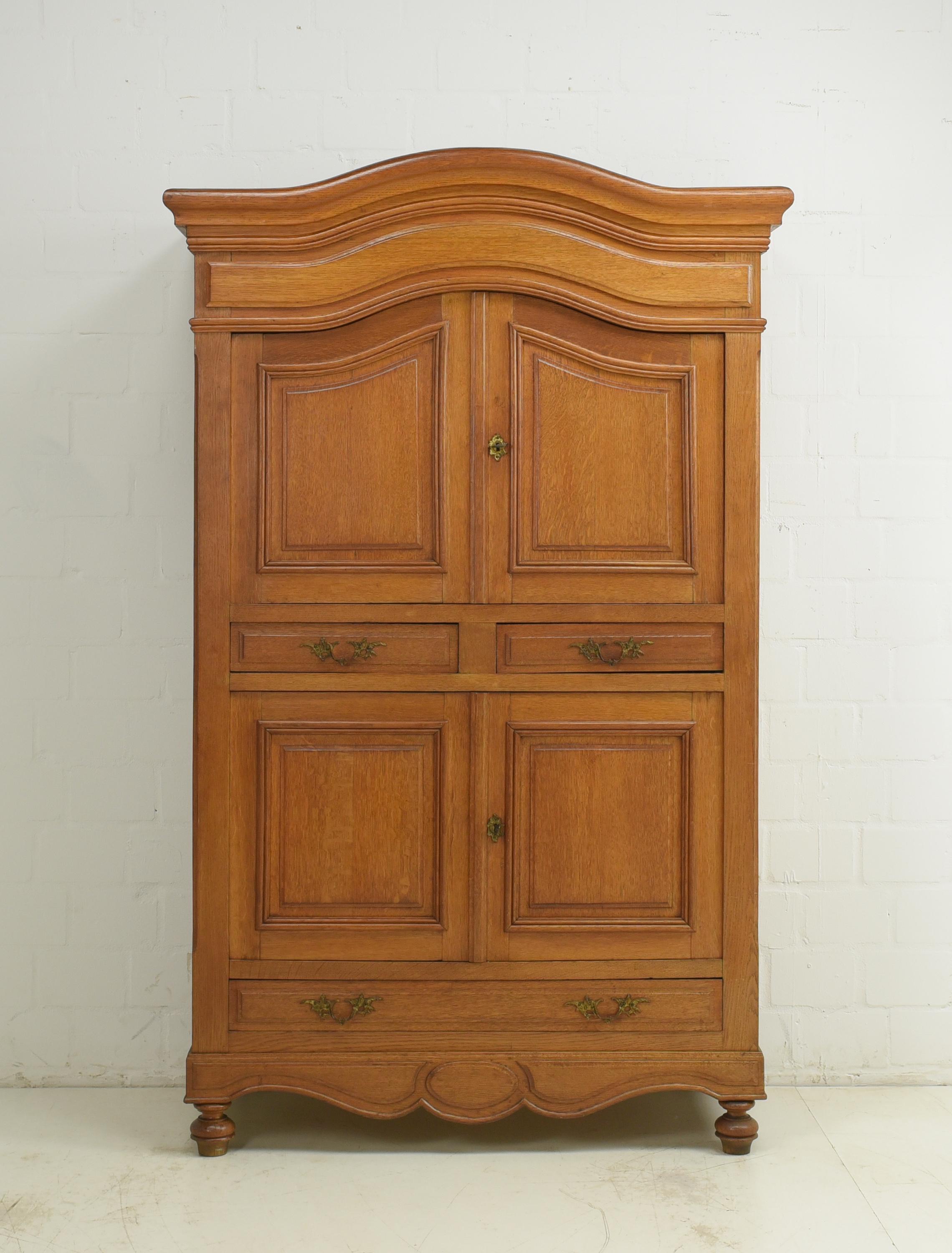 Vertiko restored around 1880 solid oak tall chest of drawers oak cupboard

Features:
Solid oak body, solid softwood inside
Four doors and three drawers
Practical division
Original fittings
Attractive, quite light color tone
Extraordinary