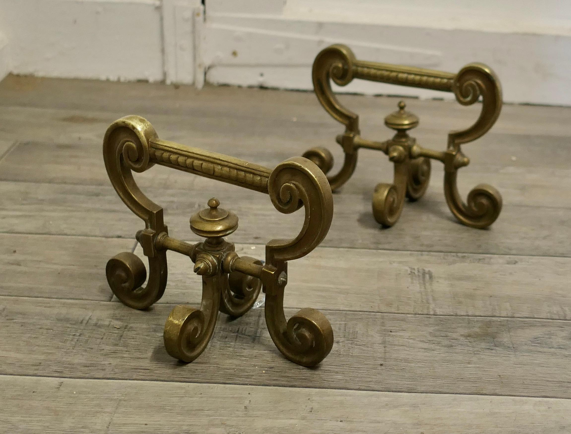 Very attractive pair of brass andirons, fire tool rests.

An elegant pair of 19th century andirons or fire dogs.
This very attractive pair of brass andirons are 11” high, 10” long and 10” wide across the front, they are in excellent used