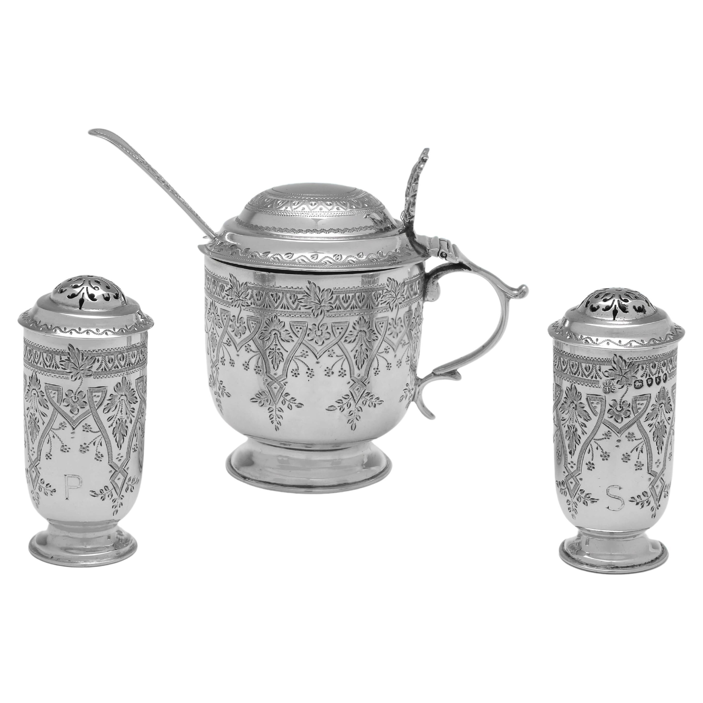 Hallmarked in London in 1885 by Aldwinckle & Slater, this very attractive, Antique Sterling Silver Condiment Set, comprises a mustard pot and spoon, a salt shaker and a pepper shaker (engraved S & P and gold plated inside the salt shaker), all
