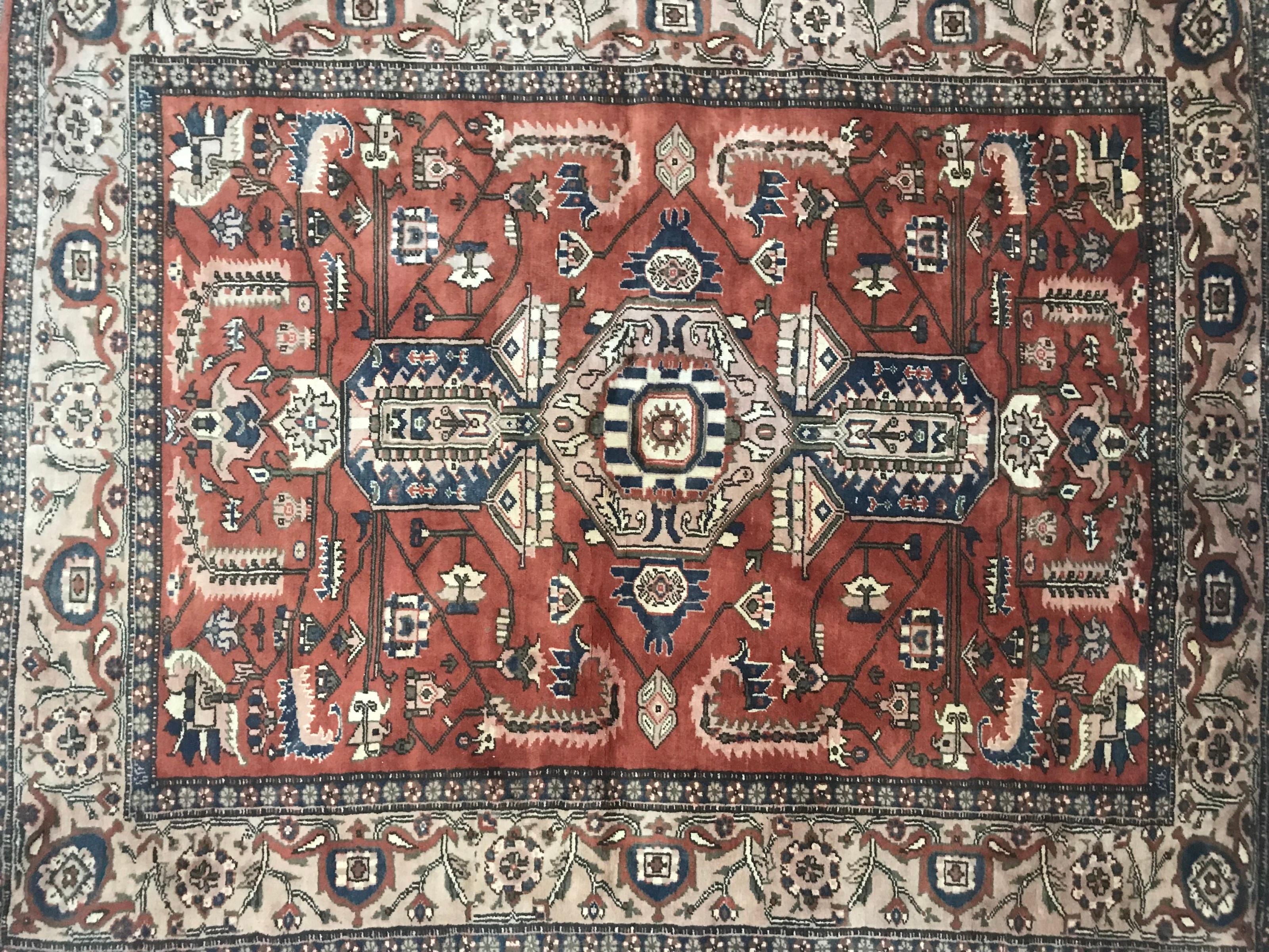 Nice Afghan rug with a beautiful design and colors with orange, blue, green and pink, entirely hand knotted with wool on cotton foundation.