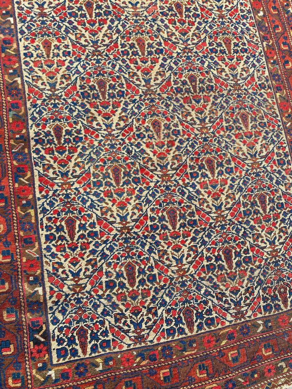 Nice antique Afshar rug with beautiful geometrical and stylized floral design and beautiful natural colors, entirely hand knotted with wool velvet on wool foundation.