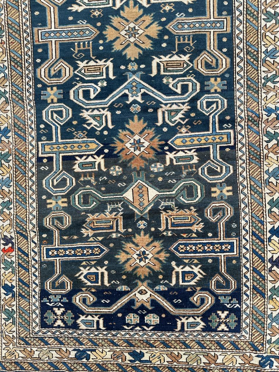 Nice late 19th century Caucasian Perepedil shirvan rug with beautiful geometrical and stylized designs typically from Perepedil rugs and nice natural colours with a blue background, light brown, dark brown, yellow, , green, blue and white in the