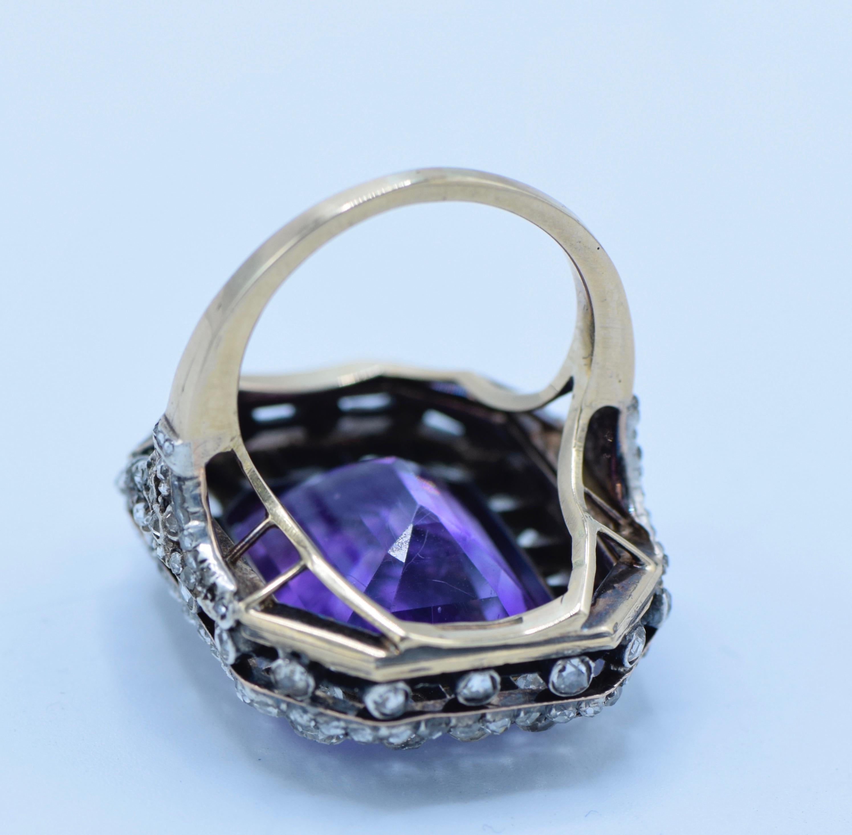Very beautiful Antique Diamond Amethyst Ring mounted in silver and gold, surrounded by old cushion cut diamonds and additional smaller rose cut diamond.
The Amethysts has a very pleasant color and is a clean bright stone 

Amethyst weight: 12- 15