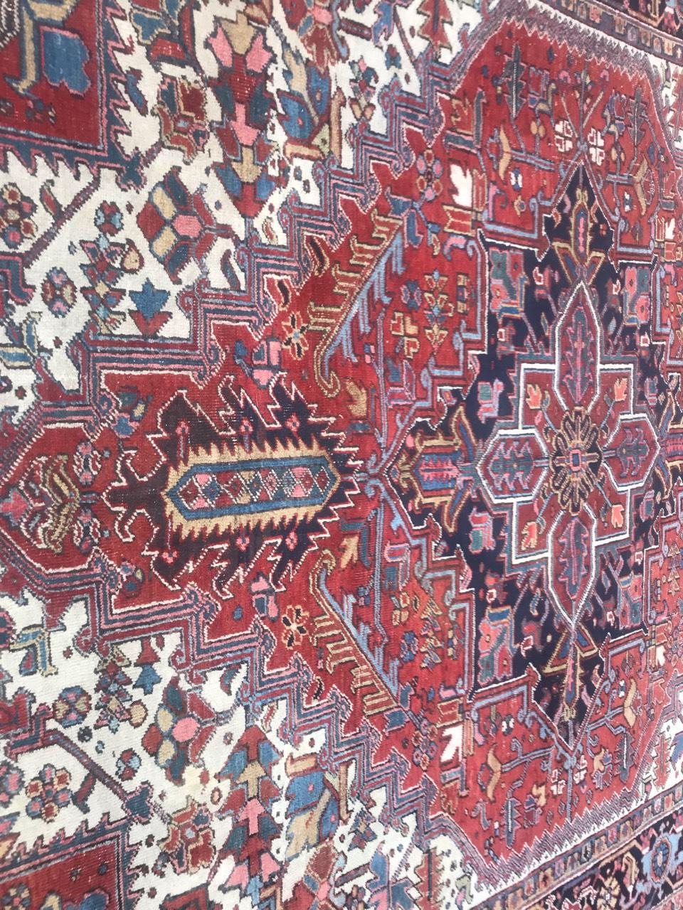 Nice early 20th century large rug with beautiful decorative design with a central medallion and natural colors with red, blue, yellow, dark blue and green, entirely hand knotted with wool velvet on cotton foundation.

 