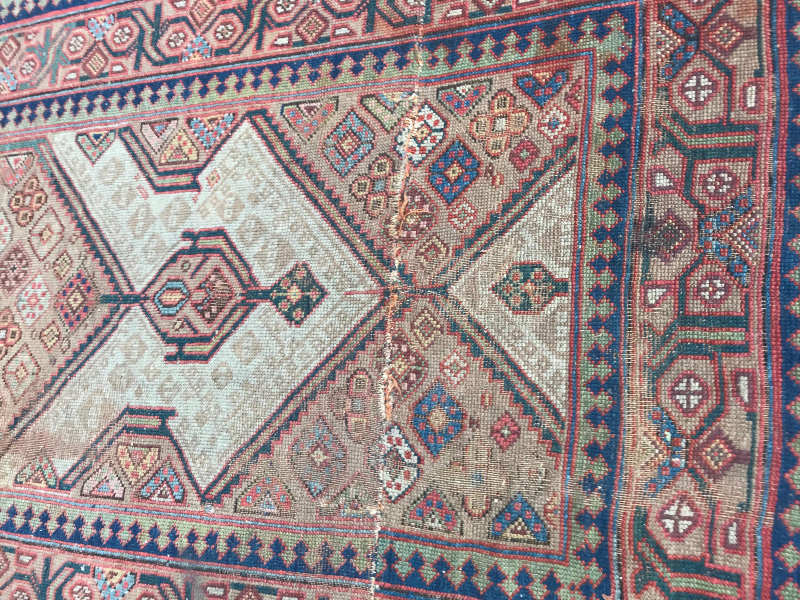 Nice late 19th century antique runner with beautiful geometrical design and natural colors with blue, pink, yellow and beige, entirely hand knotted with wool velvet on wool foundation.