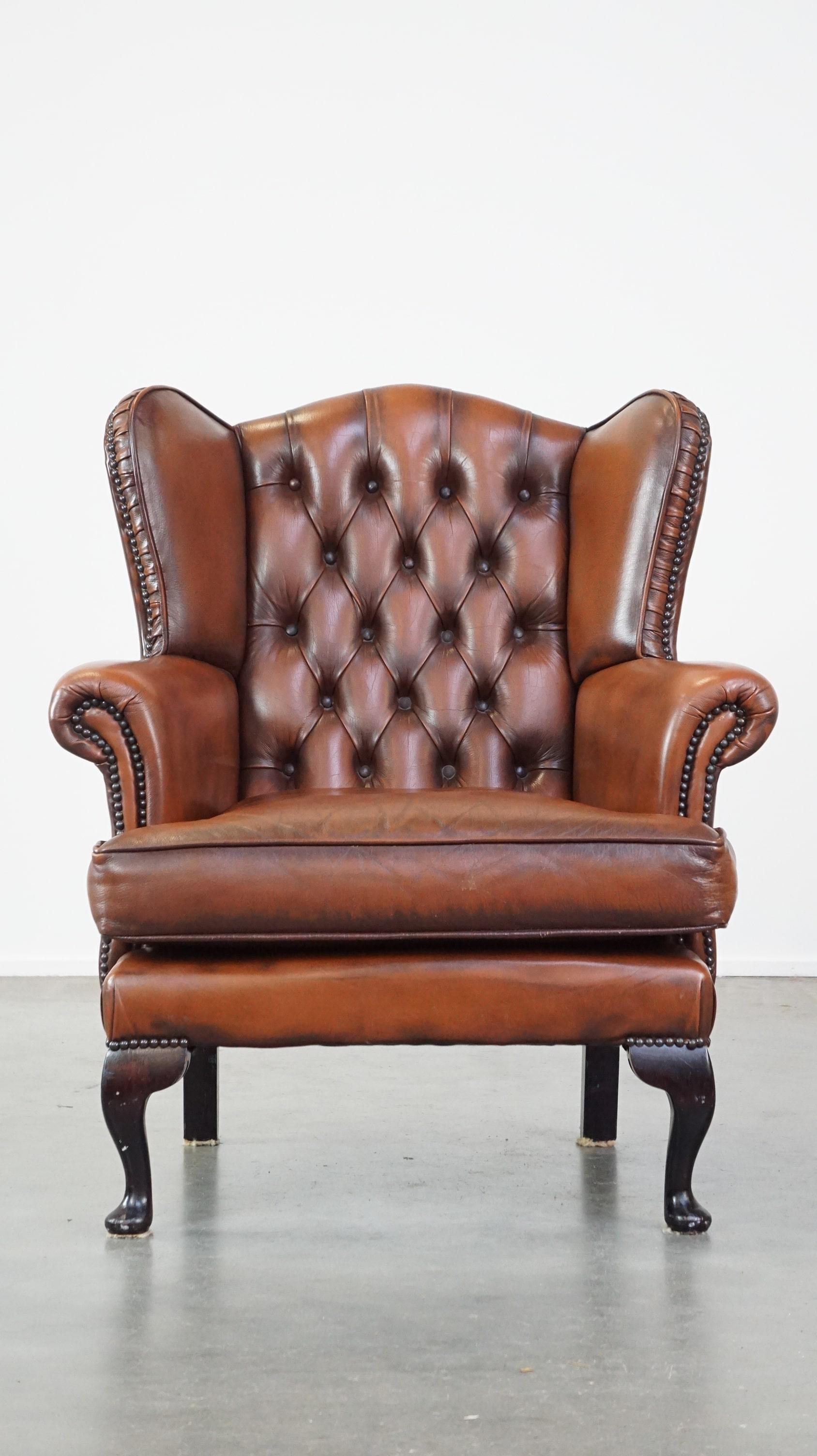 English Very beautiful cowhide Chesterfield wing chair with elegant legs in brown color For Sale