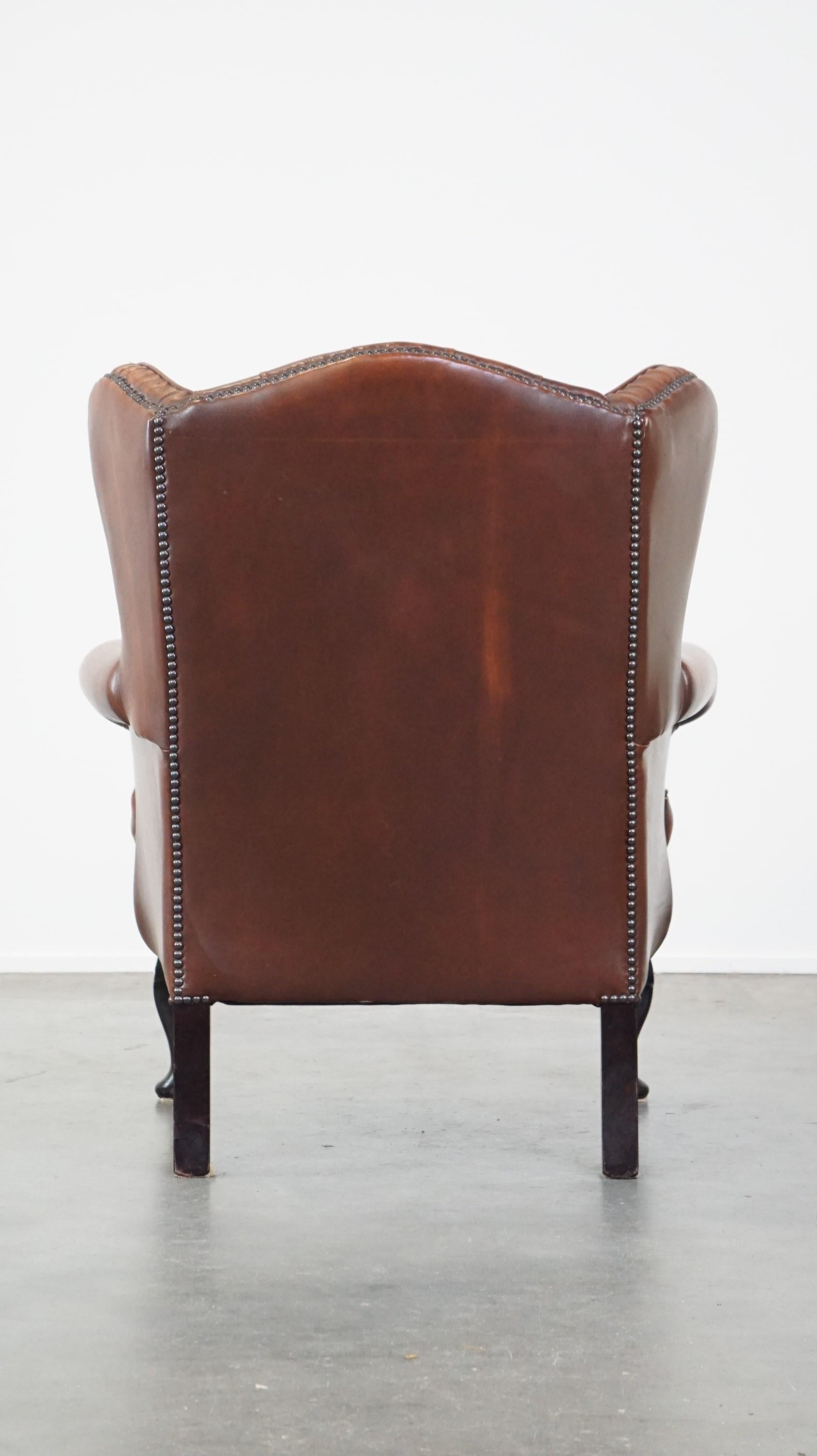 Very beautiful cowhide Chesterfield wing chair with elegant legs in brown color In Fair Condition For Sale In Harderwijk, NL