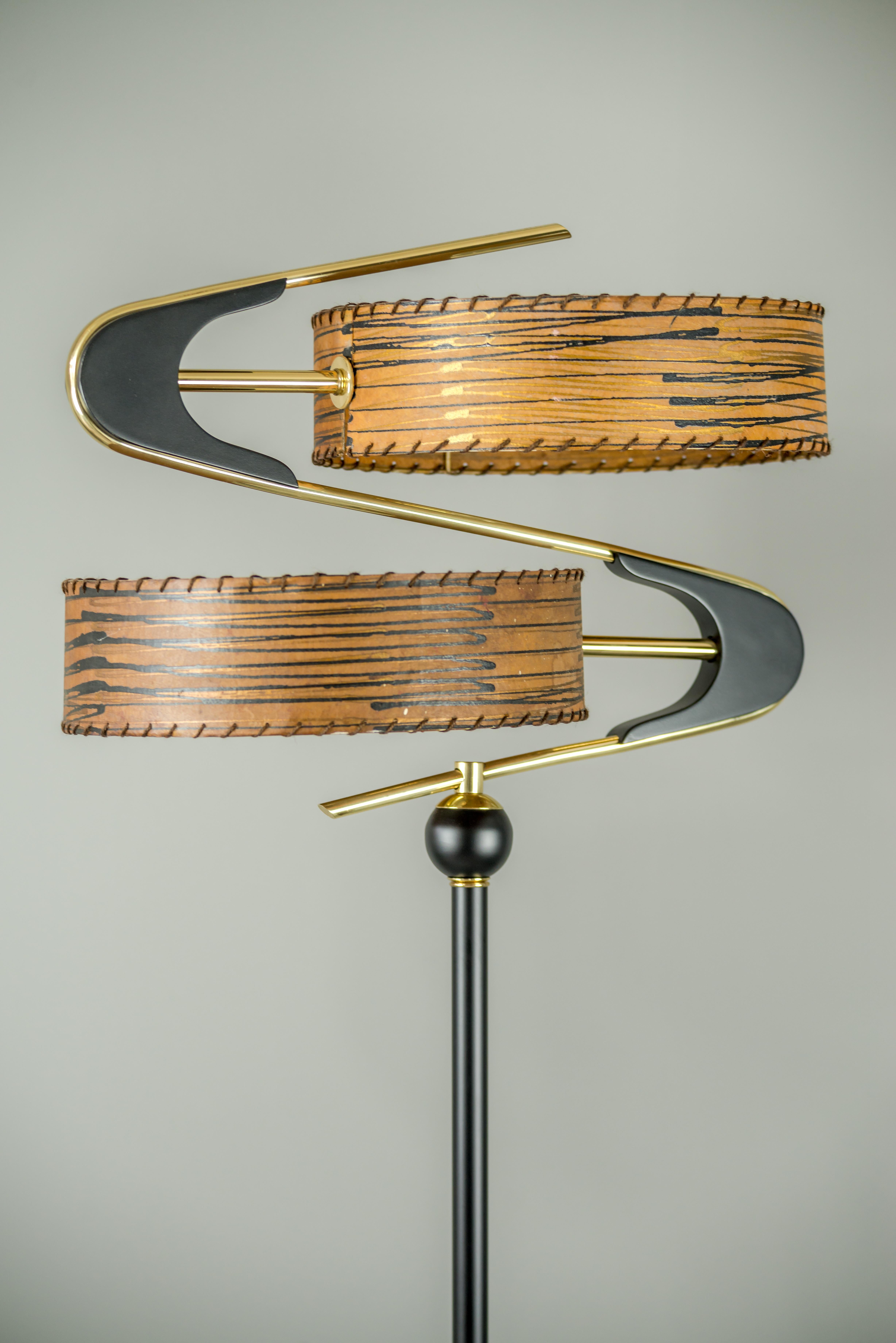 Very beautiful floor lamp, Italy, 1950s
Blackened brass
Original shades ( painted )
Brass parts polished and stove enameled.