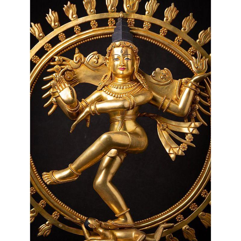 Material: bronze
57,1 cm high 
51,6 cm wide and 22 cm deep
Weight: 10.05 kgs
Fire gilded with 24 krt. gold
Originating from Nepal
Newly made in the highest quality !
As a symbol, Shiva Nataraja is a brilliant invention. It combines in a