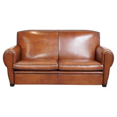 Very beautiful, in good condition, cognac-colored sheep leather sofa
