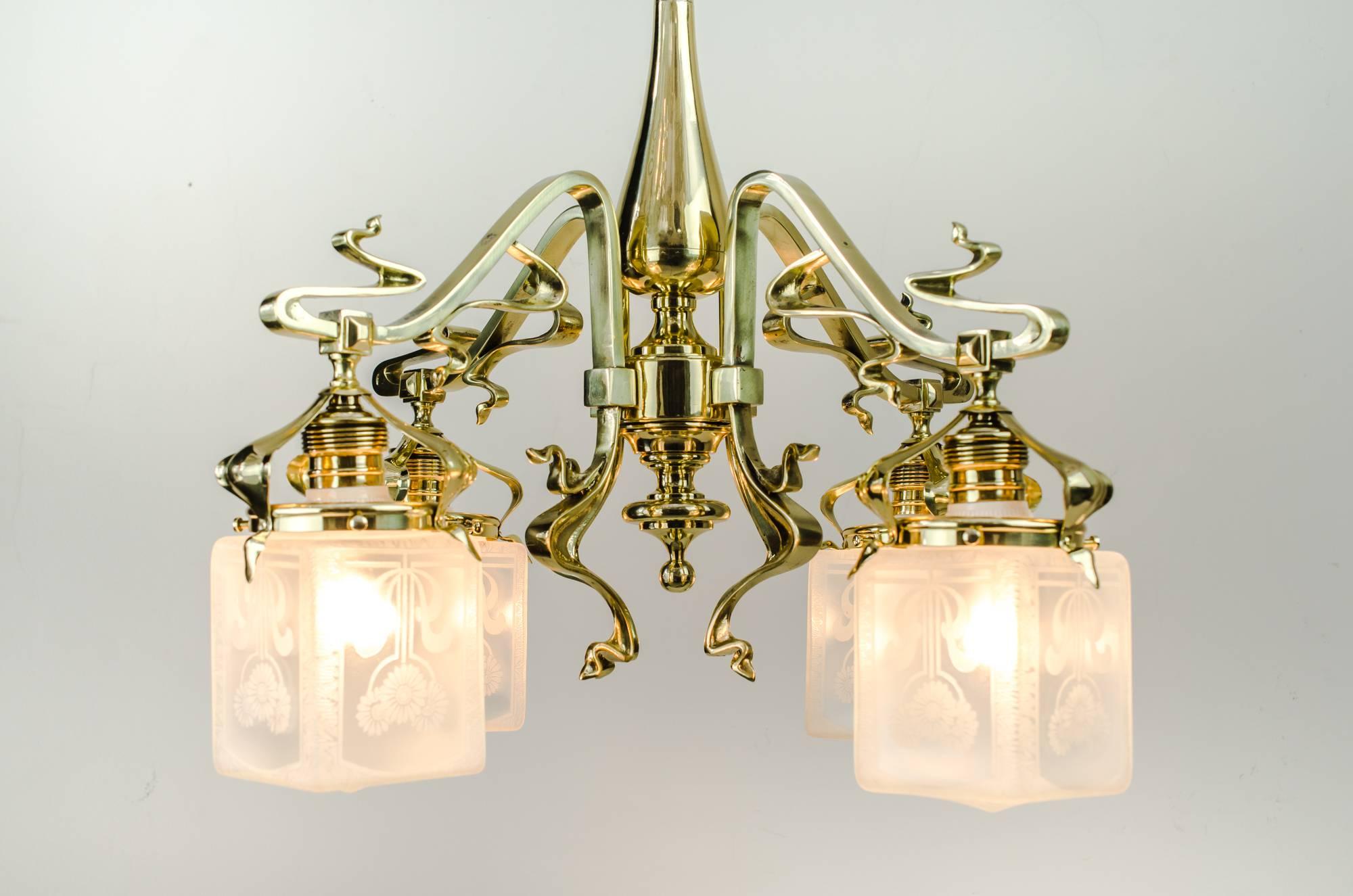 Very beautiful jugendstil floral chandelier with original glasses, circa 1908
polished and stove enamelled.