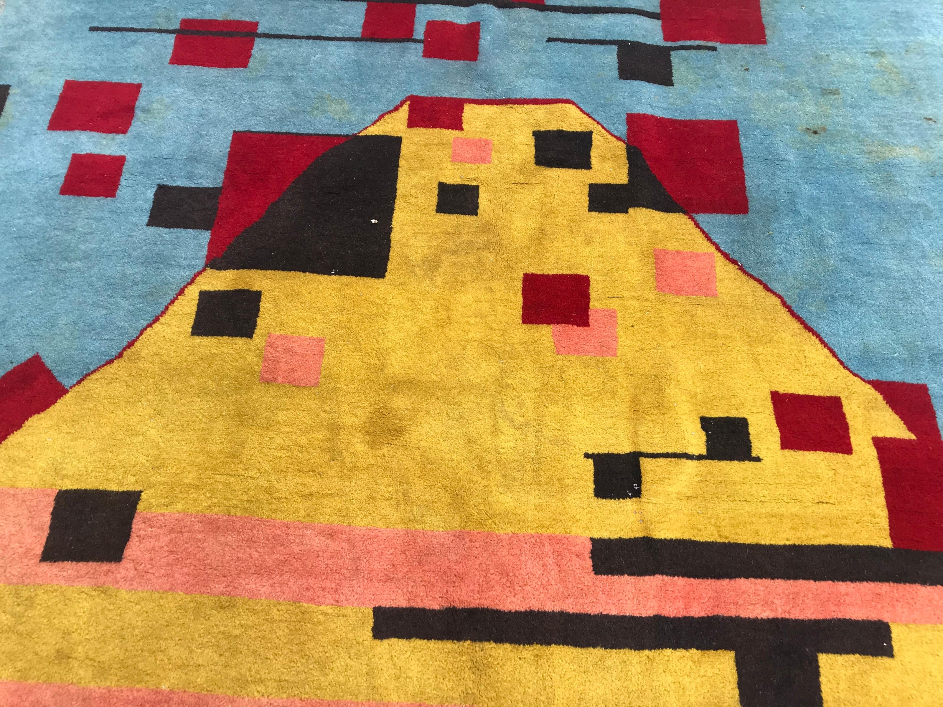 Beautiful modern contemporary rug with nice geometrical design and blue, yellow and red colors, finely hand knotted with wool velvet on cotton foundation.
