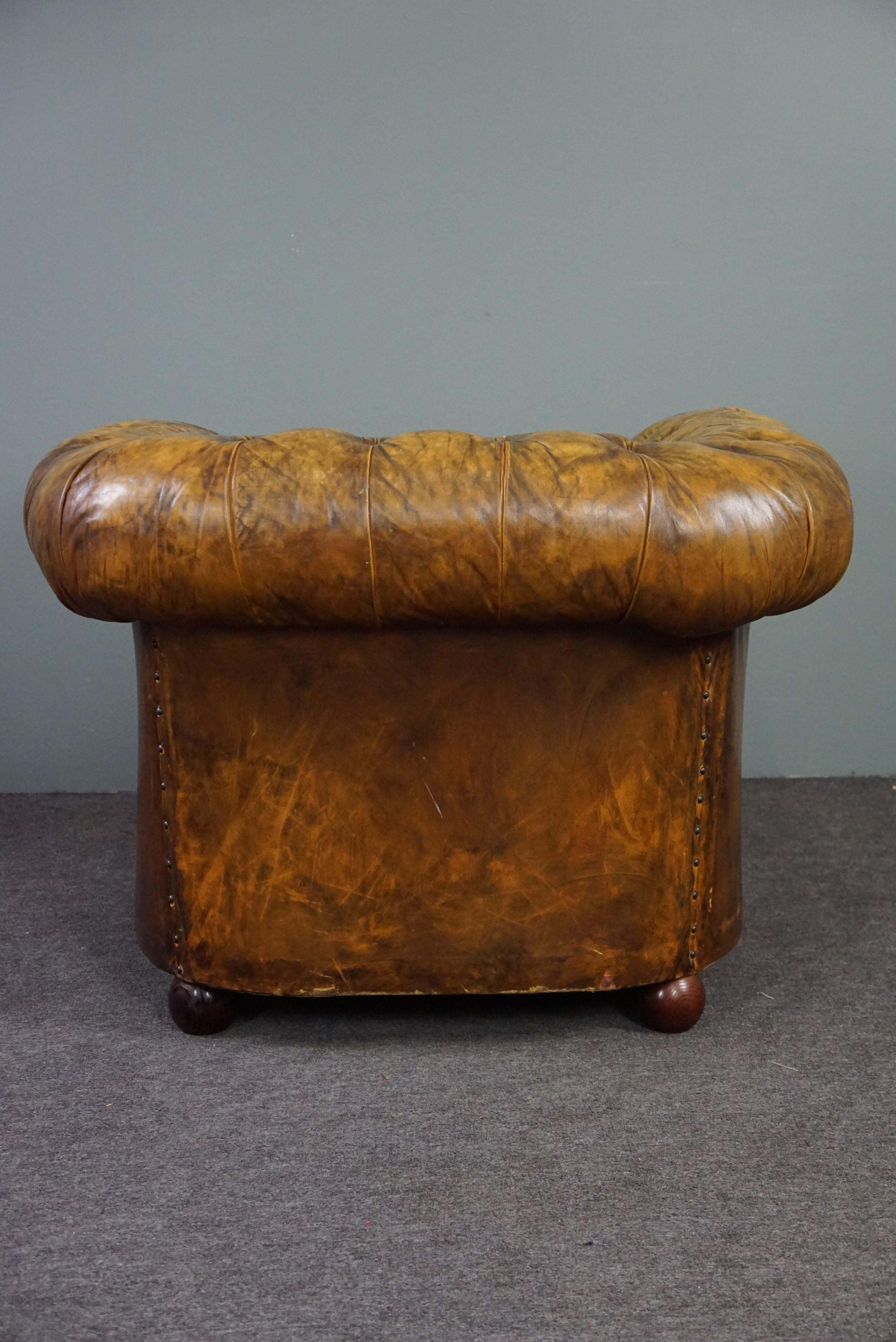 English Very beautiful old Chesterfield armchair full of patina For Sale