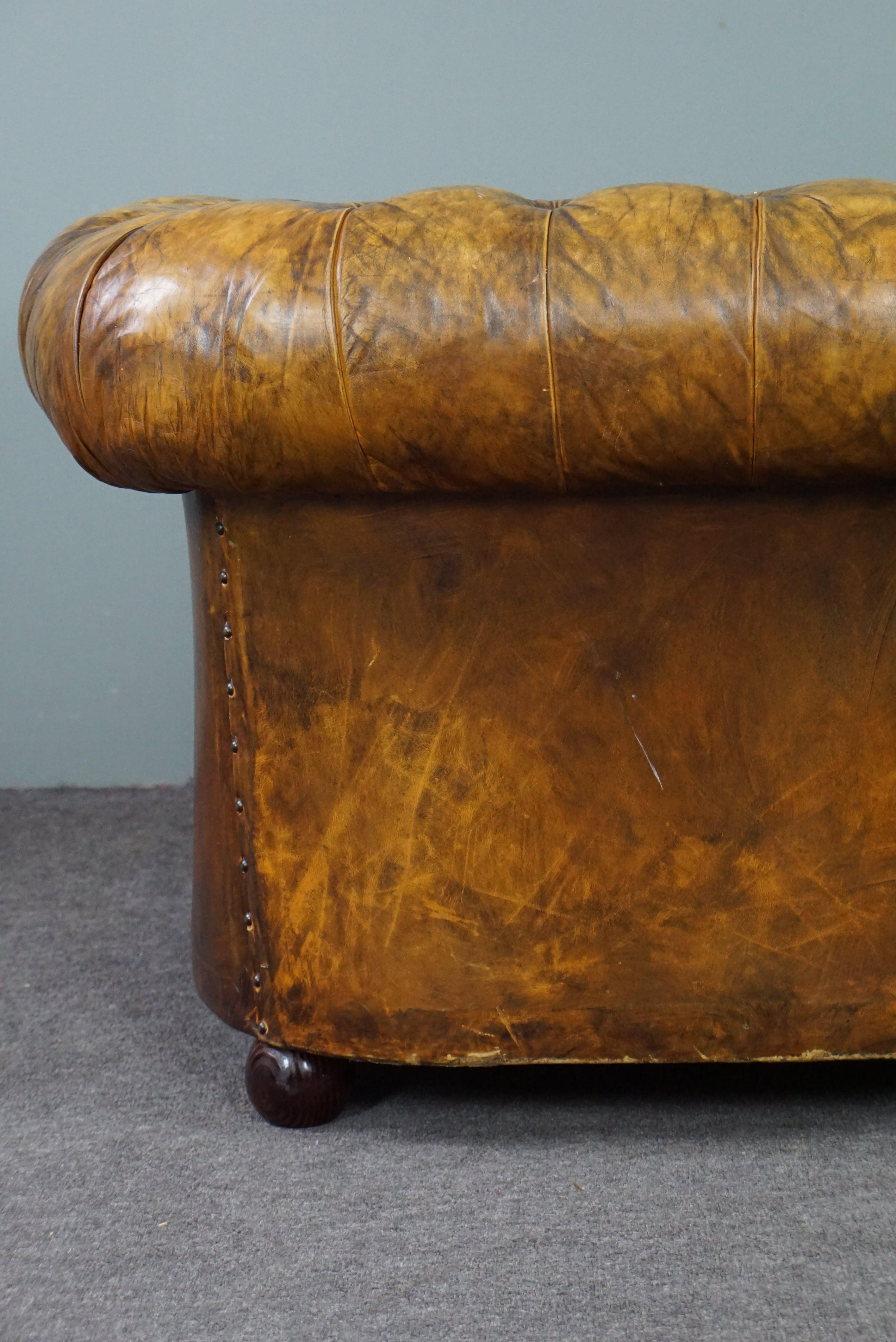 Very beautiful old Chesterfield armchair full of patina For Sale 1