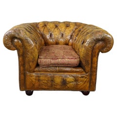 Very beautiful old Chesterfield armchair full of patina