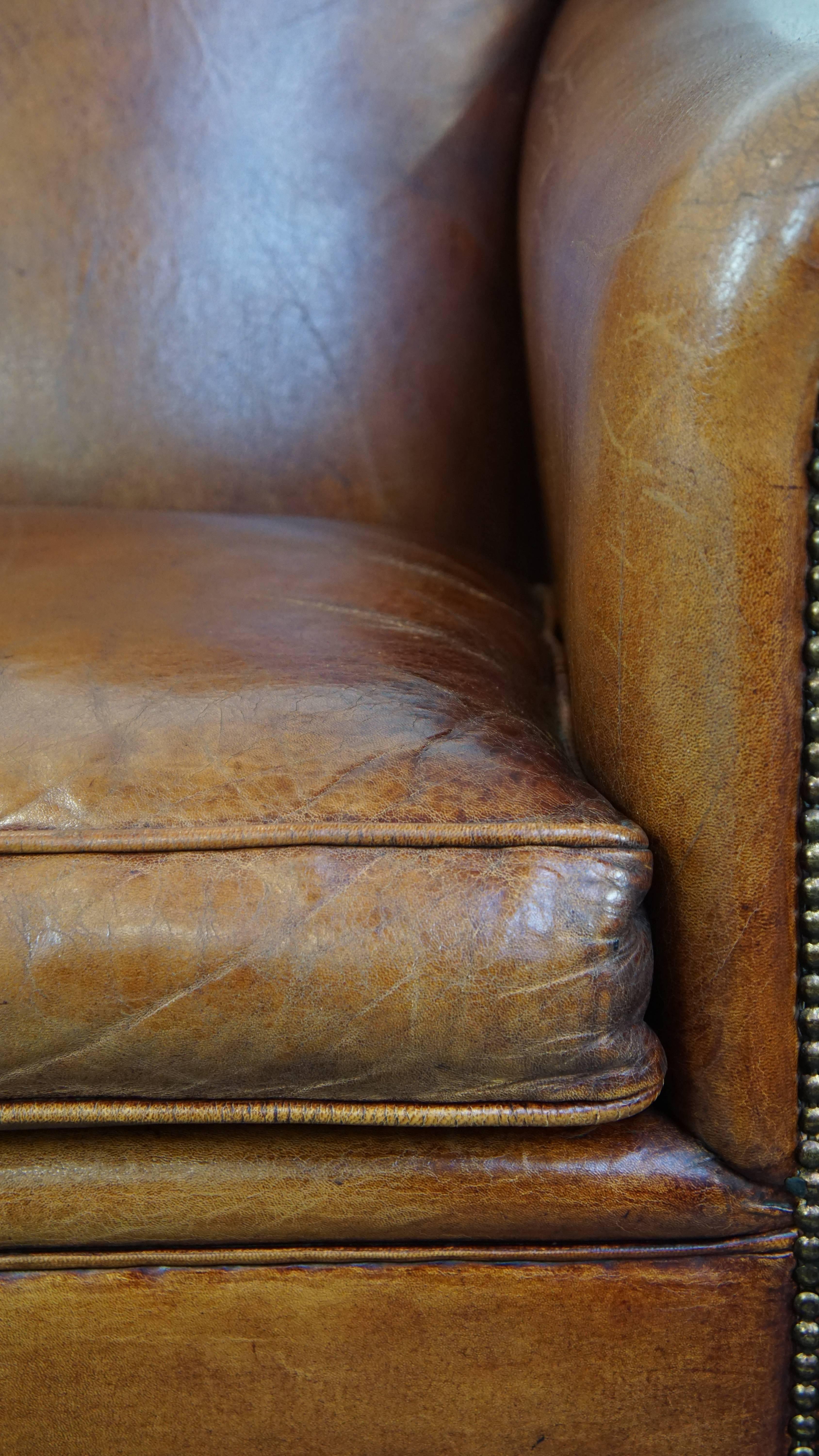 Very beautiful sheepskin armchair with an elegant design and wood-carved legs For Sale 4