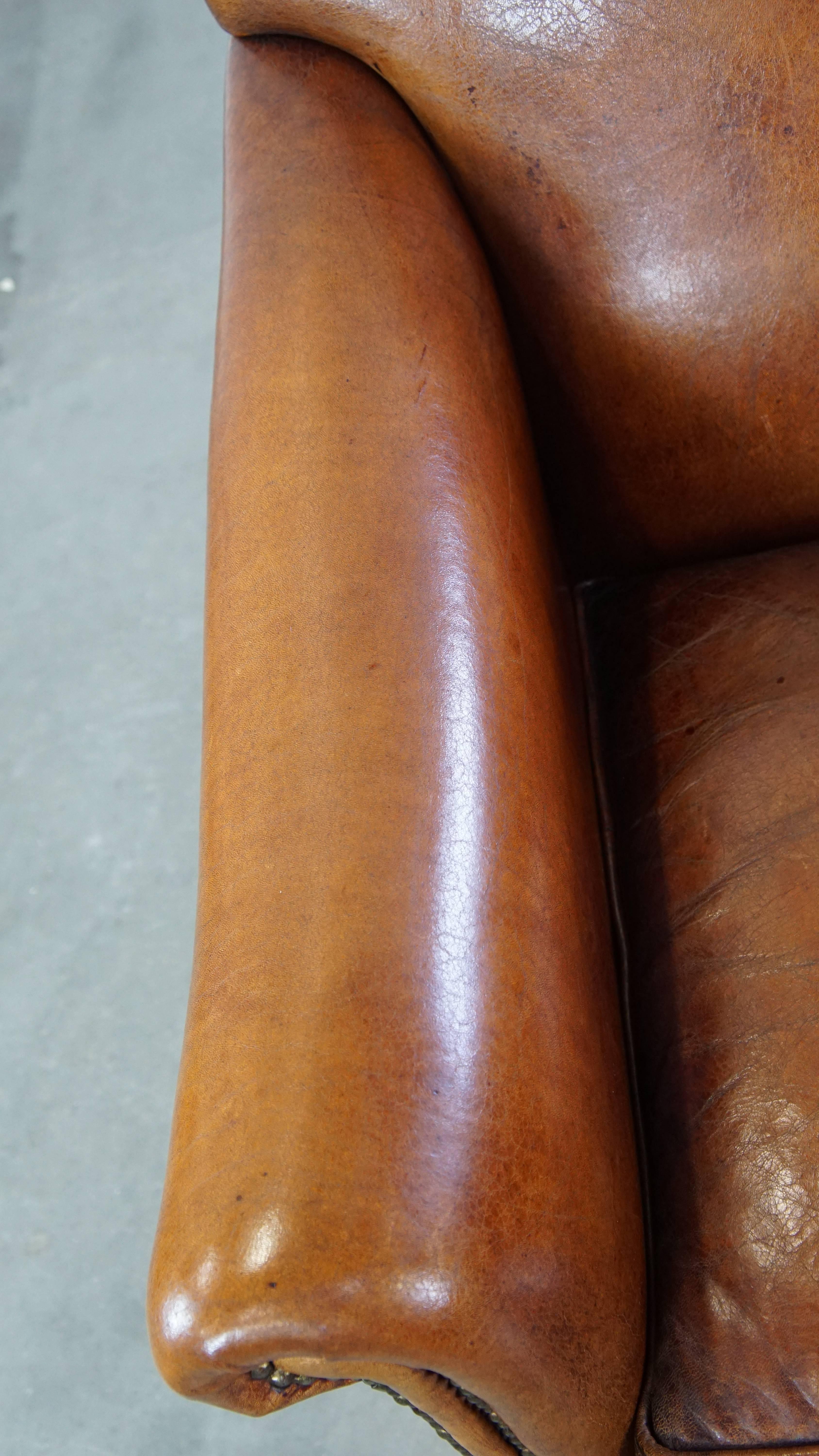 Very beautiful sheepskin armchair with an elegant design and wood-carved legs For Sale 1