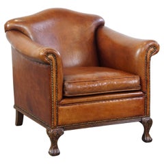 Very beautiful sheepskin armchair with an elegant design and wood-carved legs