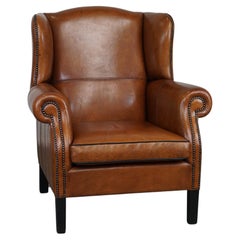 Very beautiful sheepskin leather wingback armchair with stunning details 