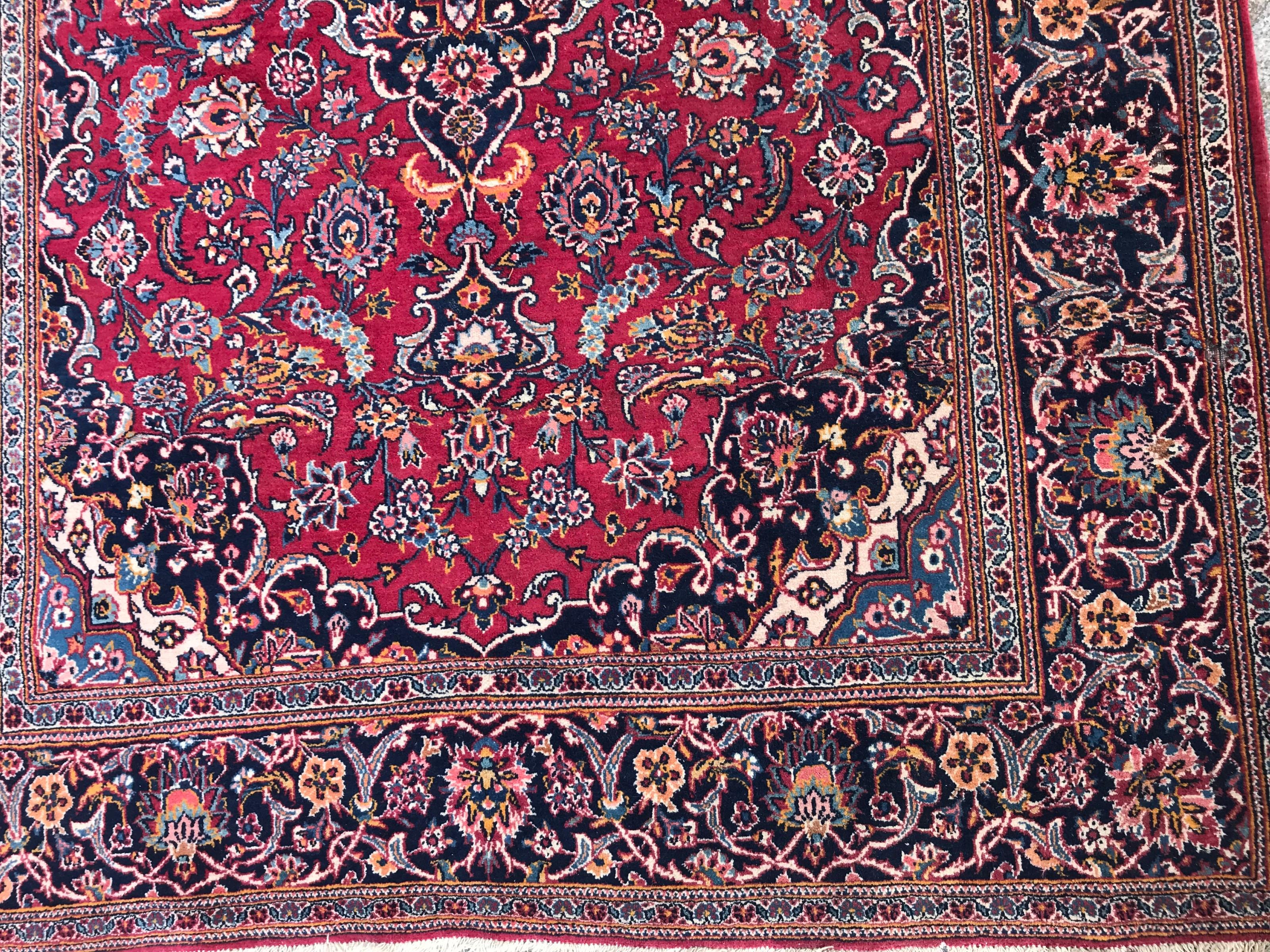 Wonderful mid-20th century rug with beautiful floral design with a nice central medallion and red, blue, field color with blue, green, orange and pink, finely hand knotted with wool velvet on cotton foundation.