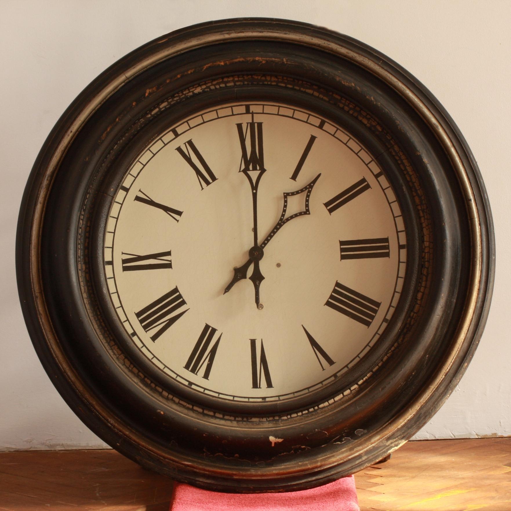 38 ½ inch oak cased iron dial grand railway clock supplied to the German Railway in 1890s. 
Marked Junghans on original unrestored mechanism. Lathed, strongly profiled wooden frame, in original color version, black stained with silvered edge, sheet