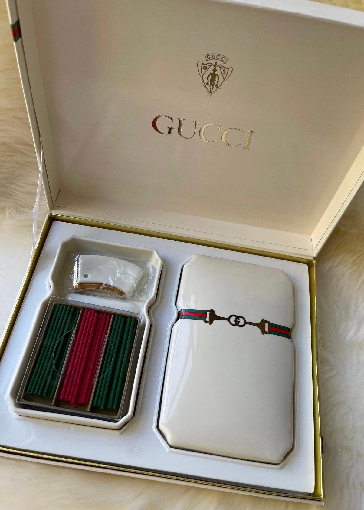 🖤RARE 1980’s Gucci🖤

Very chic Vintage GUCCI porcelain incense box with original packaging, incense sticks, and stand - all in excellent condition. 

This piece is a total conversation starter! So many uses! Can be used as a candy dish, trinket