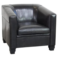 Very comfortable black Art Deco design armchair, made of sheepskin leather
