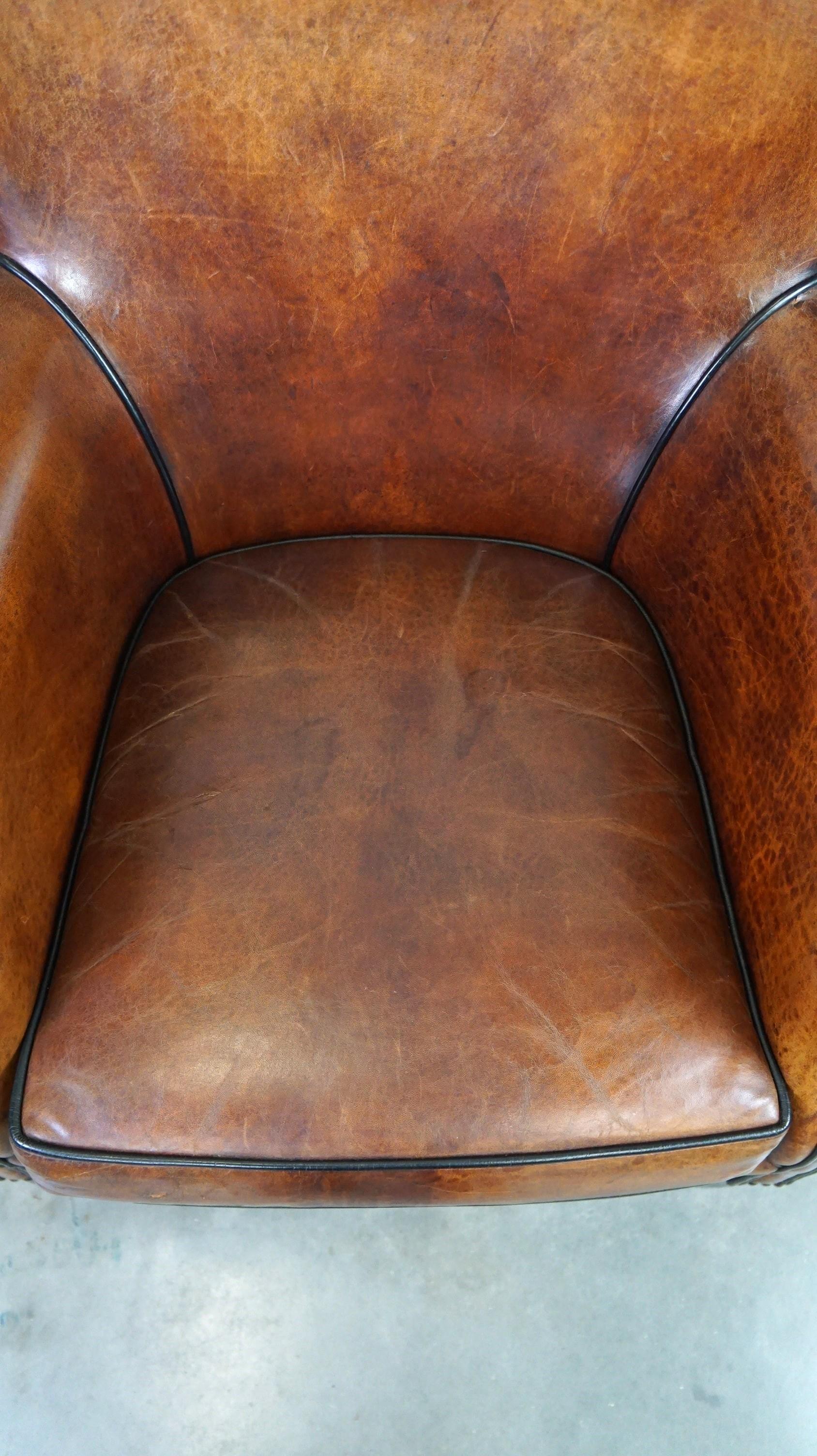 Leather Very comfortable classic sheepskin leather armchair with beautiful warm colors For Sale