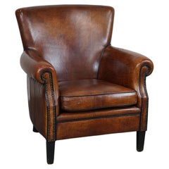 Very comfortable classic sheepskin leather armchair with beautiful warm colors