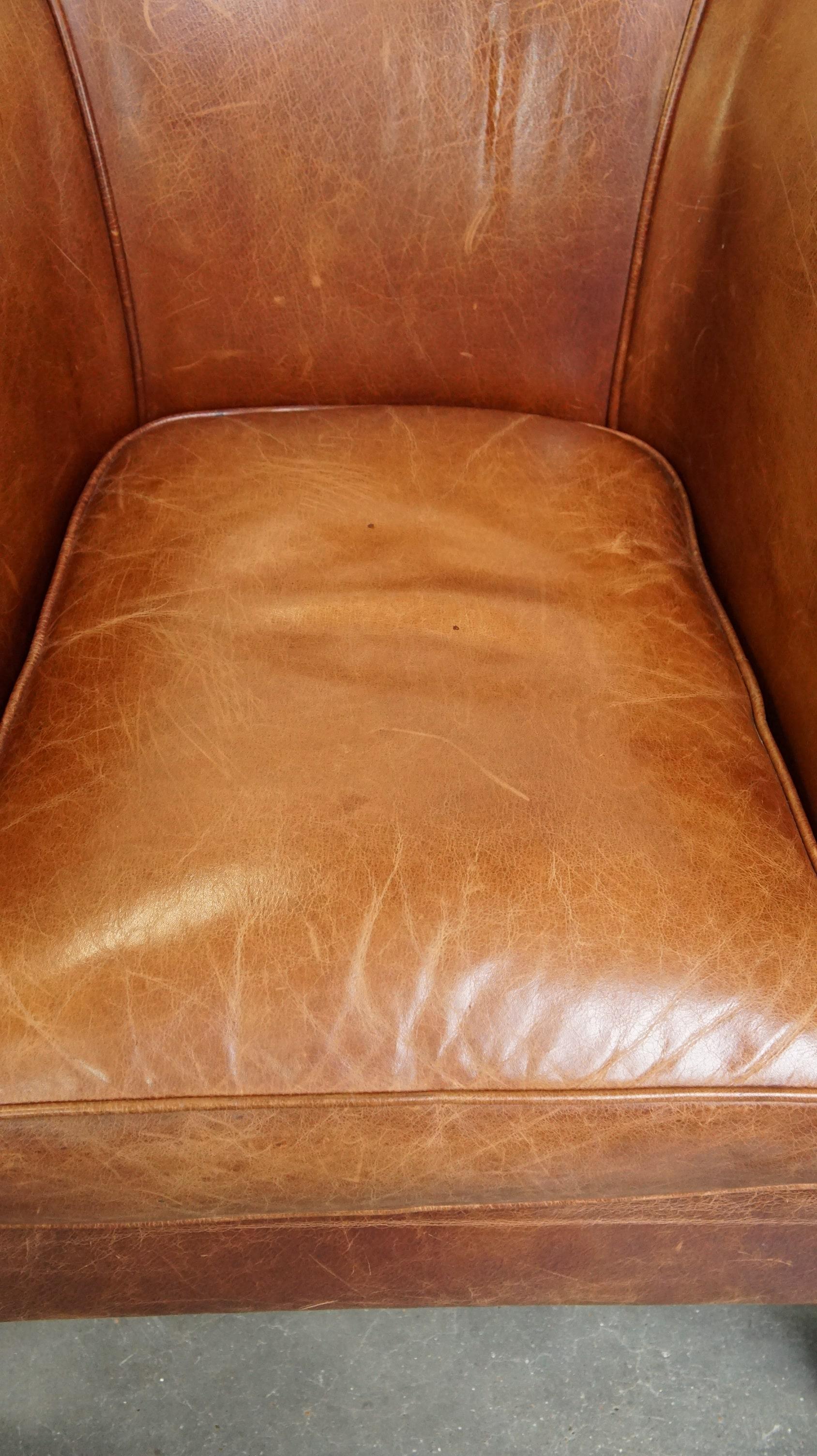 Cowhide Very comfortable, elegant leather club armchair with a removable seat cushion For Sale