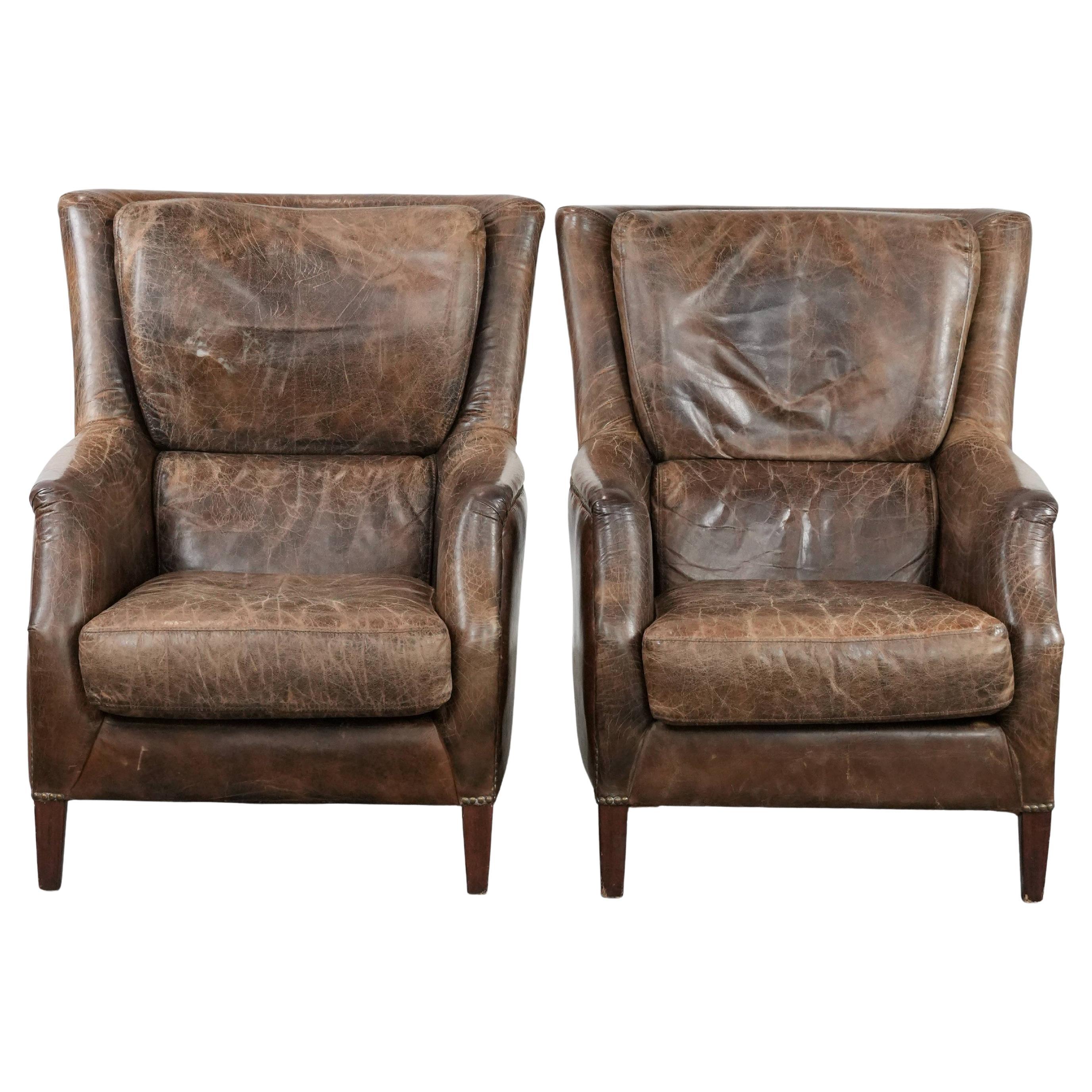 Very comfortable set of two vintage cowhide leather armchairs