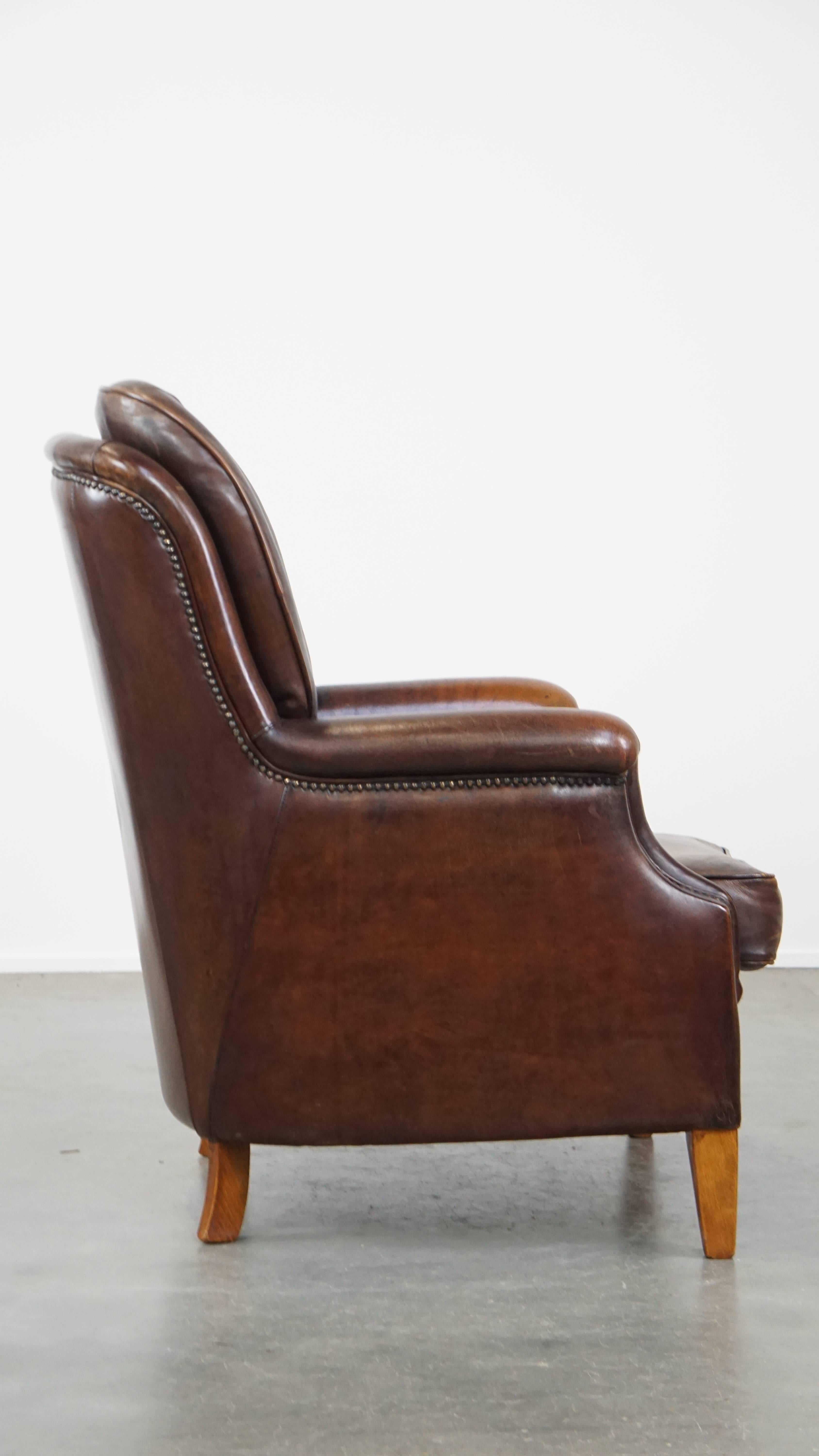 Classical Roman Very Comfortable Sheepskin Leather Armchair in a Beautiful Dark Warm Color For Sale