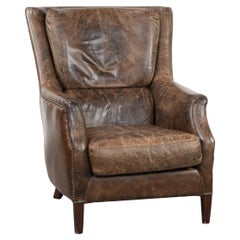 Fauteuil vintage très confortable en cuir de vachette avec de belles couleurs.