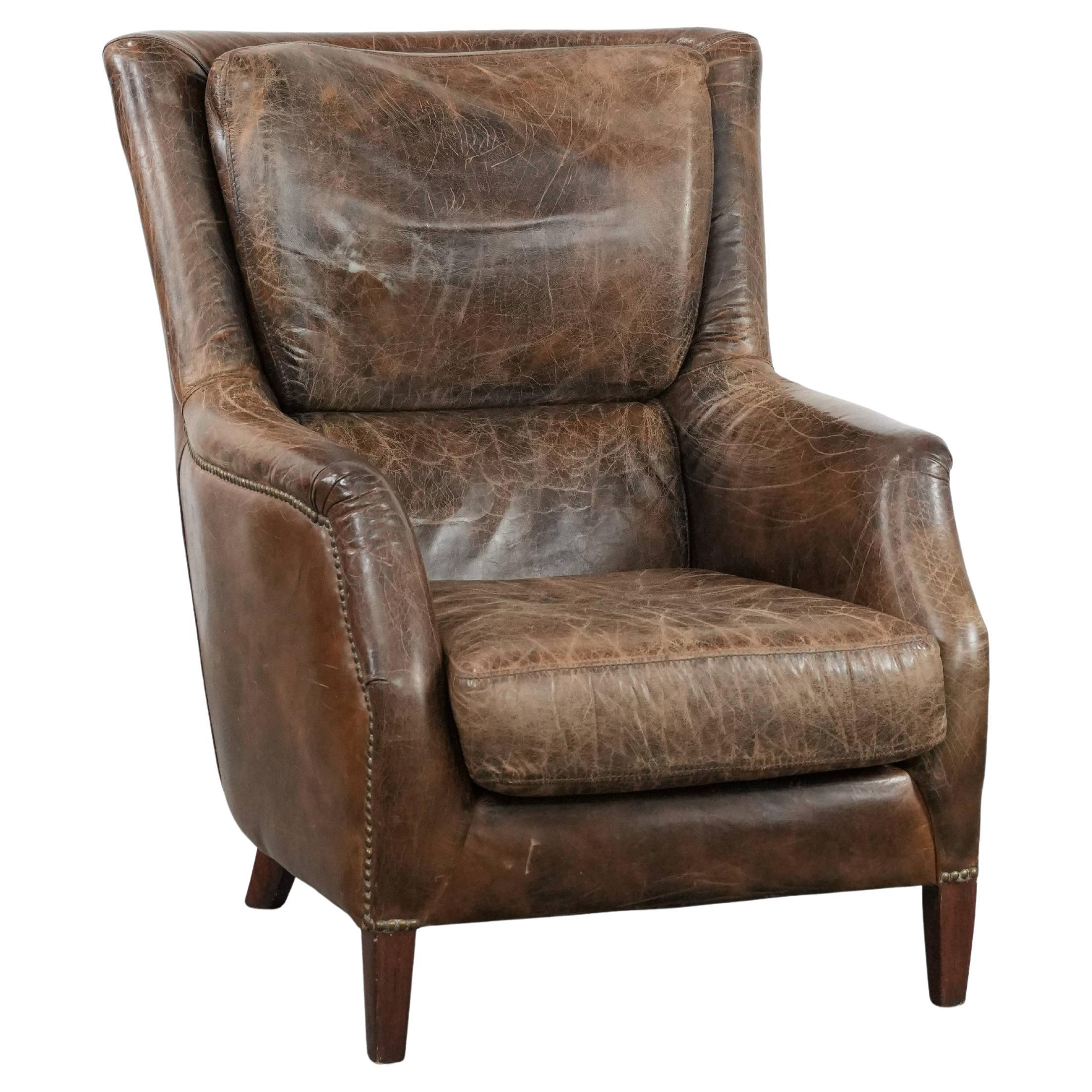 Fauteuil vintage en cuir de vachette très confortable et de caractère. en vente