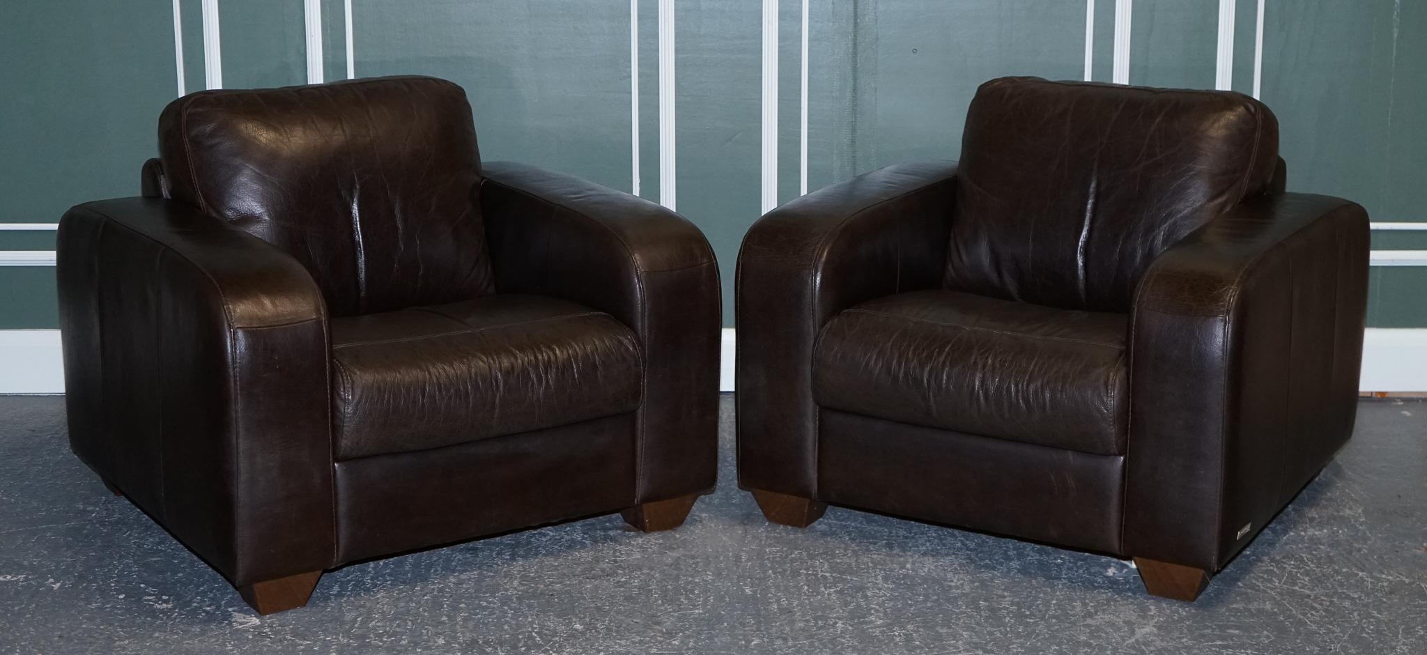 We are delighted to Present this stunning chocolate brown leather pair of armchairs.

The armchairs are made by Sofitalia which is an established Italian company, the leather is of very good Italian cow-hide quality and still has plenty of life to