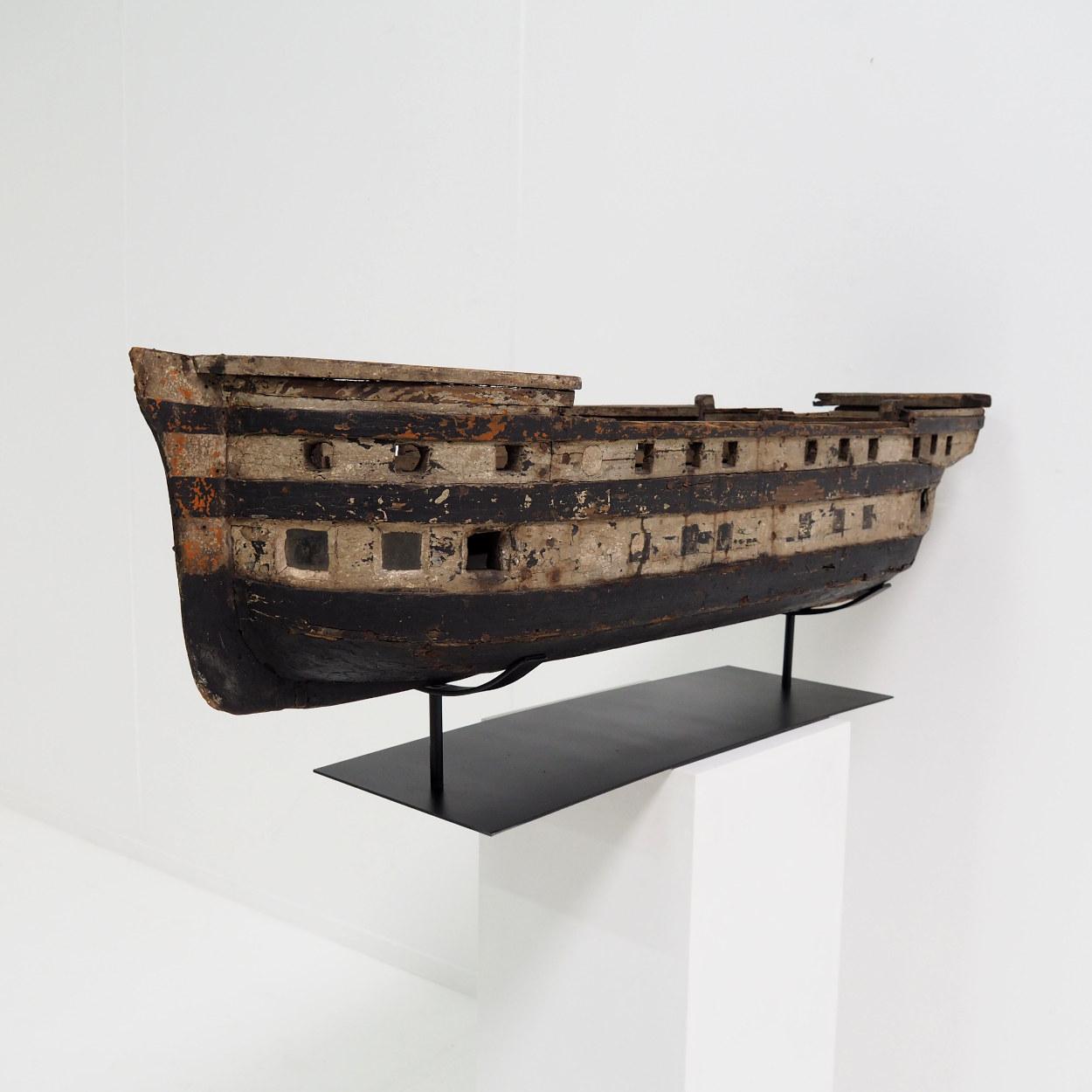 Beautiful antique ship model made of different types of painted wood.
It was most likely made as a toy as we can tell by the less detailed construction that mainly gives a general impression. So that would mean that this ship, with extra weight in