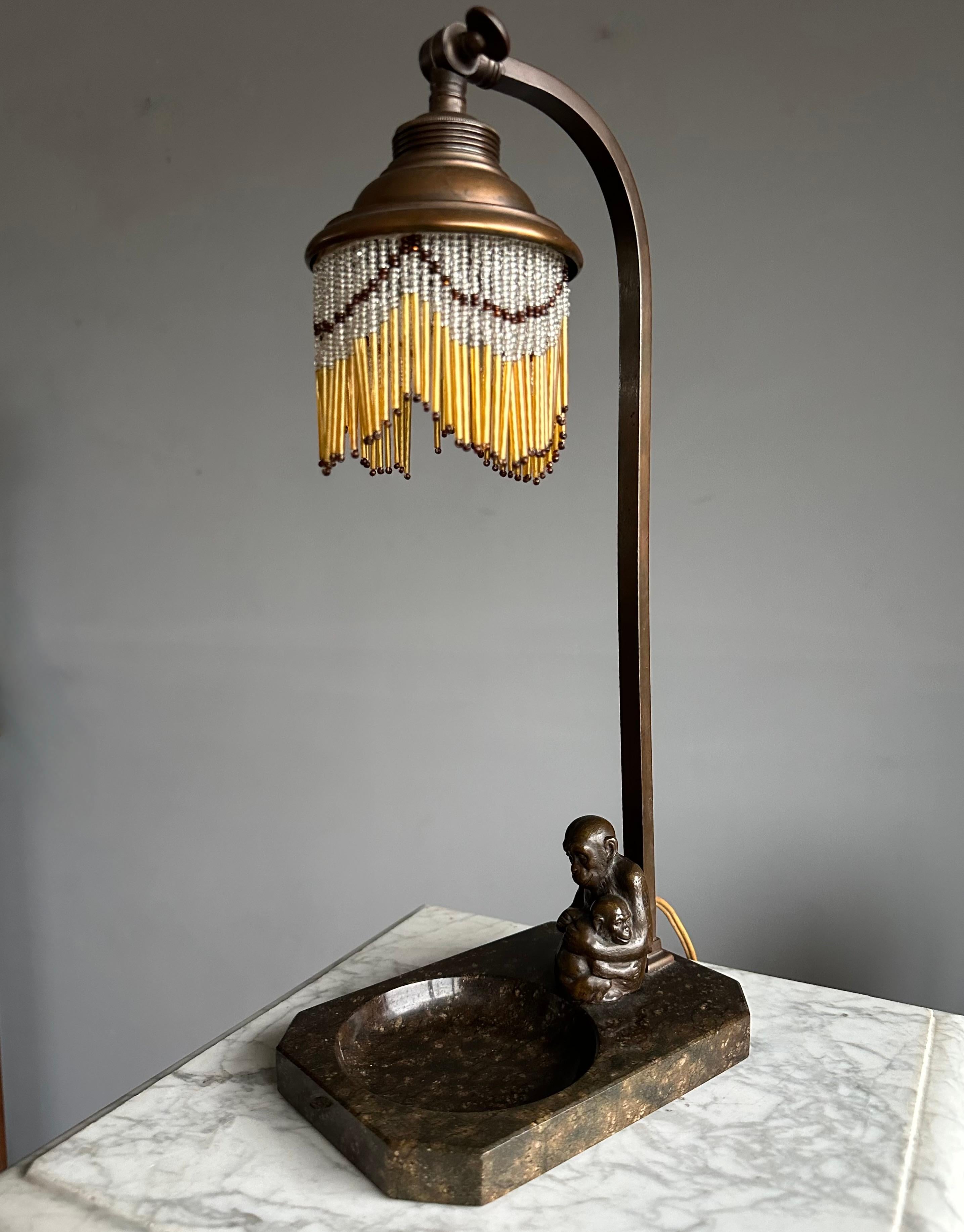 Elegant Jugendstil Bronze and Brass, Table or Desk Lamp with mother and infant chimpanzee sculpture.

We are happy to offer you another one of our recent great finds. This truly wonderful lamp from the German or Austrian Arts & Crafts era comes with